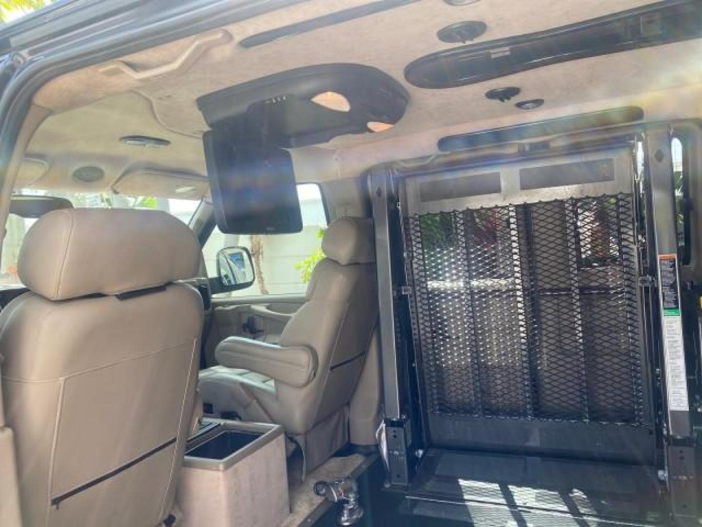 2005 Dark Blue Metallic /Neutral Chevrolet Express Van HANDICAP LIFT CONV LOW MILES 40,837 (1GBFG15T151) with an 5.3L Vortec 5300 V8 SFI Engine engine, Automatic transmission, located at 4701 North Dixie Hwy, Pompano Beach, FL, 33064, (954) 422-2889, 26.240938, -80.123474 - OUR WEBPAGE FLORIDACARS1.COM HAS OVER 100 PHOTOS AND FREE CARFAX LINK 2005 CHEVROLET REGENCY EXPRESS G1500 $20,000 - Conversion Van VIN: 1GBFG15T151226679 $20,000 - Handicap Lift $70,000 - NEW CHEVROLET REGENCY VAN 1 G B F G 1 5 T 1 5 1 2 2 6 6 7 9 VAN 5.3L V8 F GASOLINE REAR WHEEL DRIVE Features AB - Photo#82