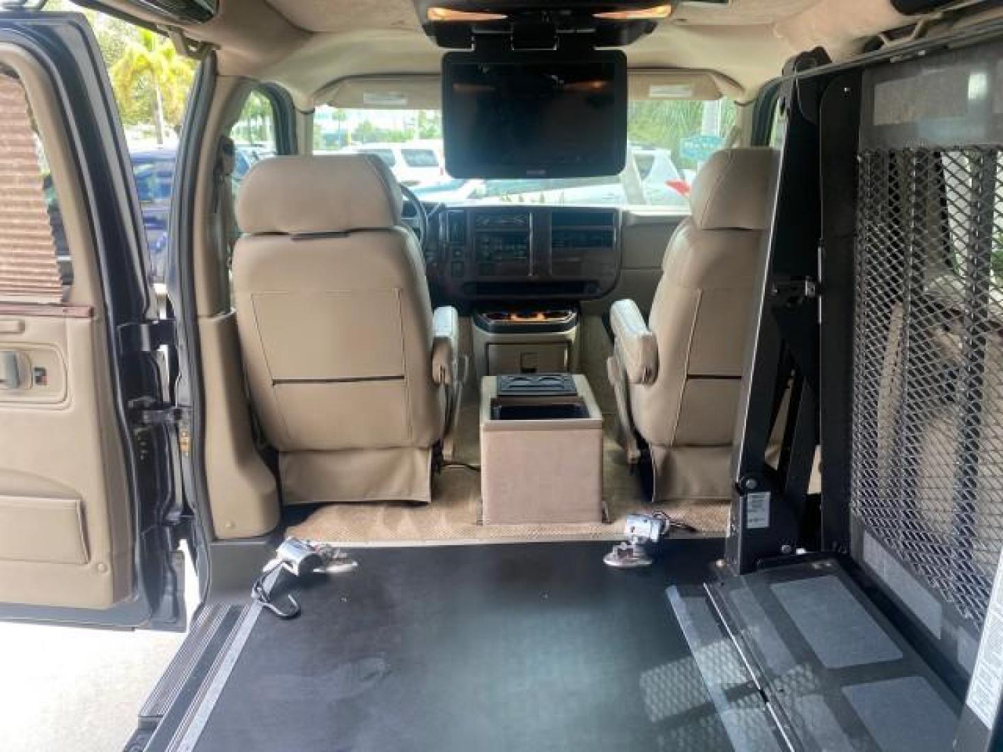 2005 Dark Blue Metallic /Neutral Chevrolet Express Van HANDICAP LIFT CONV LOW MILES 40,837 (1GBFG15T151) with an 5.3L Vortec 5300 V8 SFI Engine engine, Automatic transmission, located at 4701 North Dixie Hwy, Pompano Beach, FL, 33064, (954) 422-2889, 26.240938, -80.123474 - OUR WEBPAGE FLORIDACARS1.COM HAS OVER 100 PHOTOS AND FREE CARFAX LINK 2005 CHEVROLET REGENCY EXPRESS G1500 $20,000 - Conversion Van VIN: 1GBFG15T151226679 $20,000 - Handicap Lift $70,000 - NEW CHEVROLET REGENCY VAN 1 G B F G 1 5 T 1 5 1 2 2 6 6 7 9 VAN 5.3L V8 F GASOLINE REAR WHEEL DRIVE Features AB - Photo#87