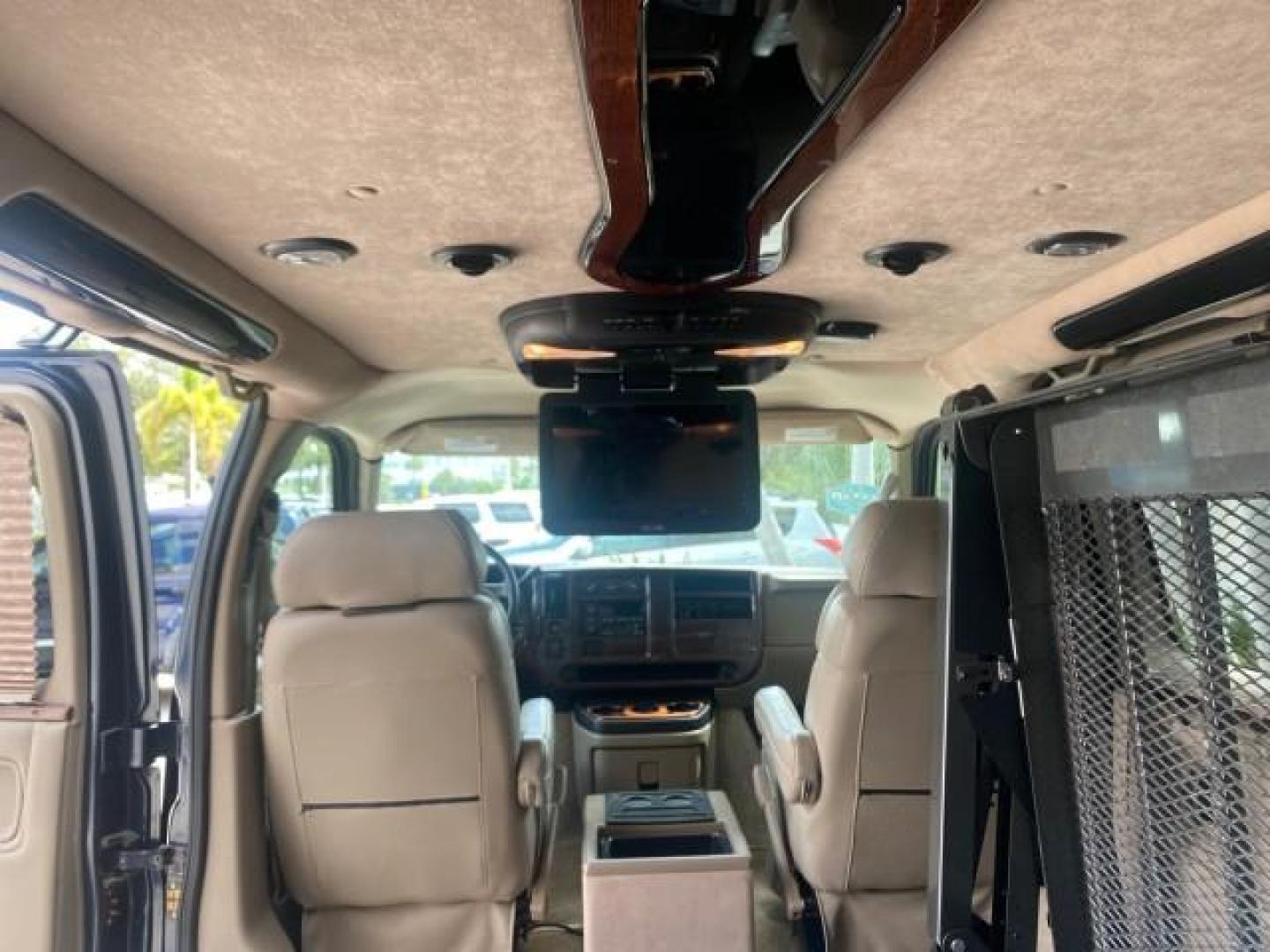 2005 Dark Blue Metallic /Neutral Chevrolet Express Van HANDICAP LIFT CONV LOW MILES 40,837 (1GBFG15T151) with an 5.3L Vortec 5300 V8 SFI Engine engine, Automatic transmission, located at 4701 North Dixie Hwy, Pompano Beach, FL, 33064, (954) 422-2889, 26.240938, -80.123474 - OUR WEBPAGE FLORIDACARS1.COM HAS OVER 100 PHOTOS AND FREE CARFAX LINK 2005 CHEVROLET REGENCY EXPRESS G1500 $20,000 - Conversion Van VIN: 1GBFG15T151226679 $20,000 - Handicap Lift $70,000 - NEW CHEVROLET REGENCY VAN 1 G B F G 1 5 T 1 5 1 2 2 6 6 7 9 VAN 5.3L V8 F GASOLINE REAR WHEEL DRIVE Features AB - Photo#88