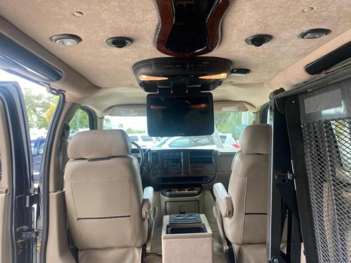 2005 Dark Blue Metallic /Neutral Chevrolet Express Van HANDICAP LIFT CONV LOW MILES 40,837 (1GBFG15T151) with an 5.3L Vortec 5300 V8 SFI Engine engine, Automatic transmission, located at 4701 North Dixie Hwy, Pompano Beach, FL, 33064, (954) 422-2889, 26.240938, -80.123474 - OUR WEBPAGE FLORIDACARS1.COM HAS OVER 100 PHOTOS AND FREE CARFAX LINK 2005 CHEVROLET REGENCY EXPRESS G1500 $20,000 - Conversion Van VIN: 1GBFG15T151226679 $20,000 - Handicap Lift $70,000 - NEW CHEVROLET REGENCY VAN 1 G B F G 1 5 T 1 5 1 2 2 6 6 7 9 VAN 5.3L V8 F GASOLINE REAR WHEEL DRIVE Features AB - Photo#92