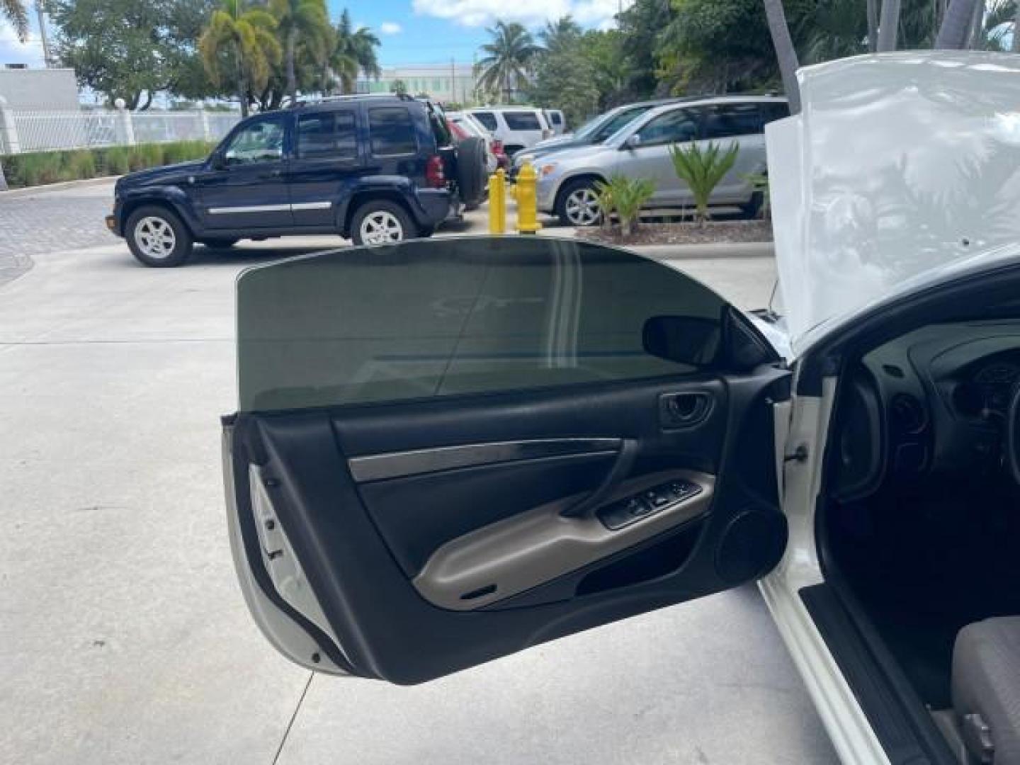 2004 Dover White Pearl /Midnight Mitsubishi Eclipse AUTO GS LOW MILES 57,084 (4A3AC44G24E) with an 2.4L SOHC MPFI 16-Valve I4 Engine engine, Automatic transmission, located at 4701 North Dixie Hwy, Pompano Beach, FL, 33064, (954) 422-2889, 26.240938, -80.123474 - OUR WEBPAGE FLORIDACARS1.COM HAS OVER 100 PHOTOS AND FREE CARFAX LINK 2004 MITSUBISHI ECLIPSE GS VIN: 4A3AC44G24E061723 4 A 3 A C 4 4 G 2 4 E 0 6 1 7 2 3 HATCHBACK 2 DR 2.4L I4 F GASOLINE FRONT WHEEL DRIVE Features Air Conditioning Alloy Wheels AM/FM Stereo Automatic Transmission CD Audio Cloth Seat - Photo#9