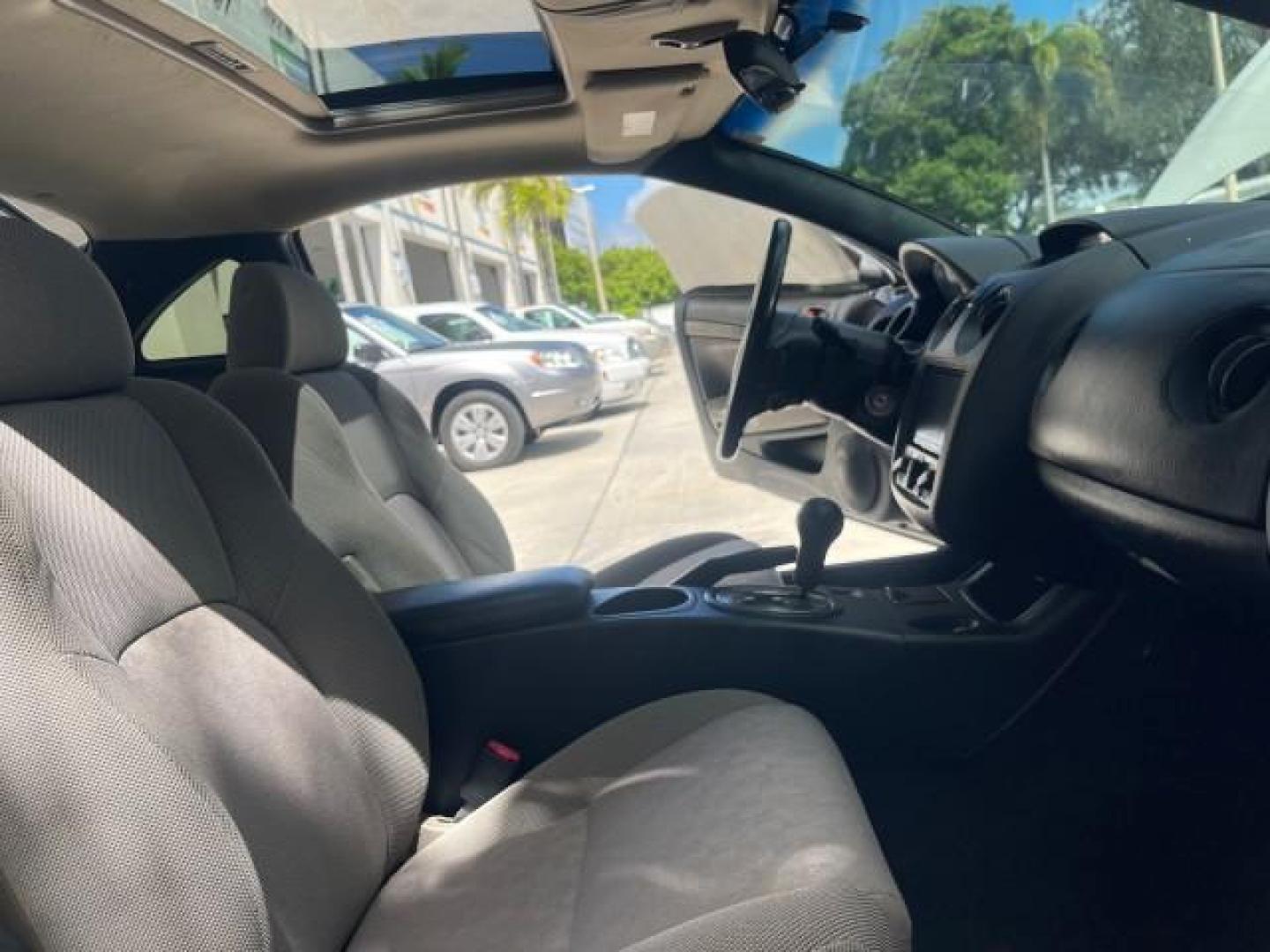 2004 Dover White Pearl /Midnight Mitsubishi Eclipse AUTO GS LOW MILES 57,084 (4A3AC44G24E) with an 2.4L SOHC MPFI 16-Valve I4 Engine engine, Automatic transmission, located at 4701 North Dixie Hwy, Pompano Beach, FL, 33064, (954) 422-2889, 26.240938, -80.123474 - OUR WEBPAGE FLORIDACARS1.COM HAS OVER 100 PHOTOS AND FREE CARFAX LINK 2004 MITSUBISHI ECLIPSE GS VIN: 4A3AC44G24E061723 4 A 3 A C 4 4 G 2 4 E 0 6 1 7 2 3 HATCHBACK 2 DR 2.4L I4 F GASOLINE FRONT WHEEL DRIVE Features Air Conditioning Alloy Wheels AM/FM Stereo Automatic Transmission CD Audio Cloth Seat - Photo#12