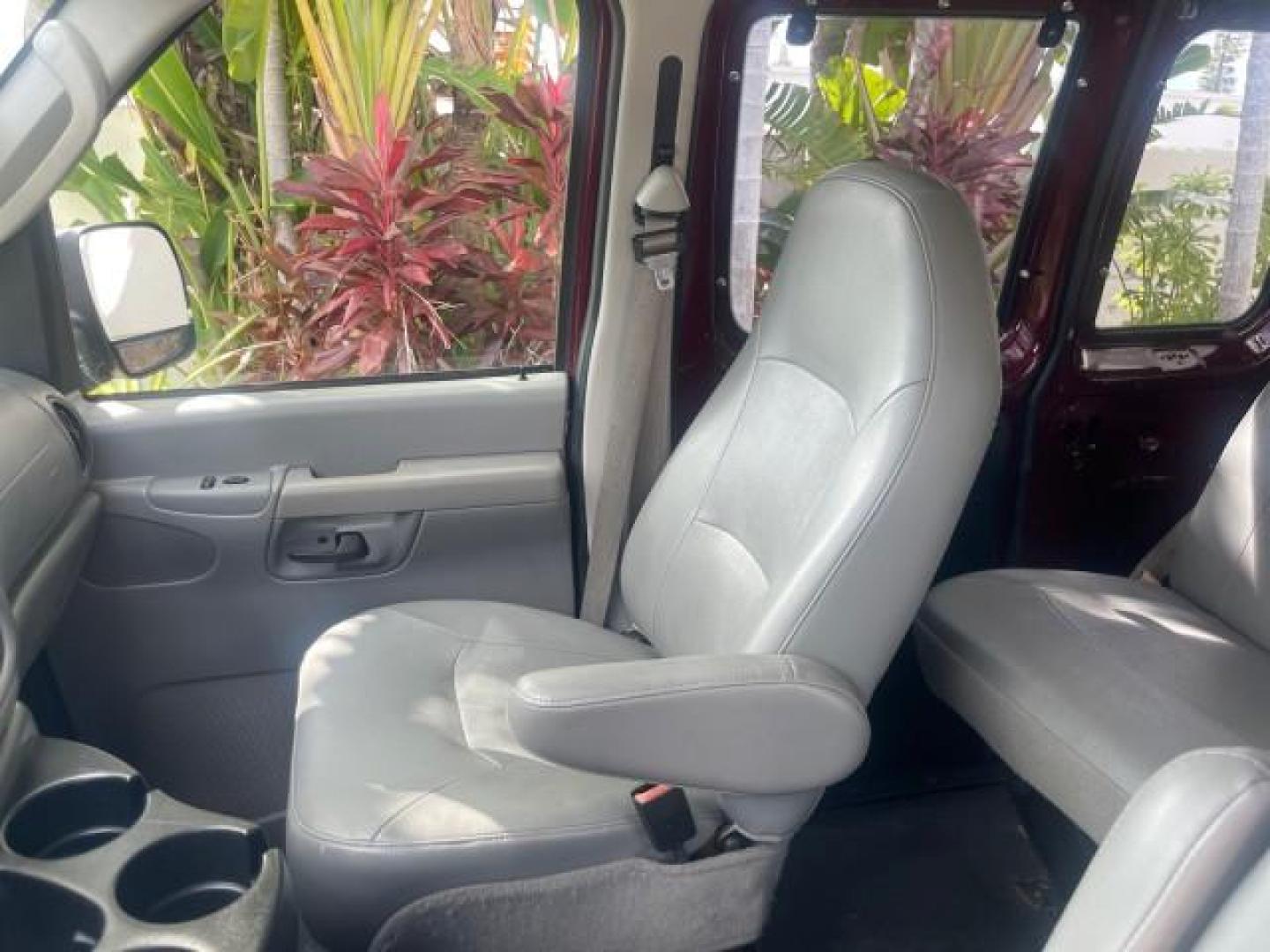 2006 Dark Toreador Red Metallic /Medium Flint Ford Econoline Wagon XLT 8 PASS LOW MILES 56290 (1FMRE11W06D) with an 4.6L EFI V8 Engine engine, Automatic transmission, located at 4701 North Dixie Hwy, Pompano Beach, FL, 33064, (954) 422-2889, 26.240938, -80.123474 - OUR WEBPAGE FLORIDACARS1.COM HAS OVER 100 PHOTOS AND FREE CARFAX LINK 2006 FORD E-SERIES E-150 XLT VIN: 1FMRE11W06DA64988 1 F M R E 1 1 W 0 6 D A 6 4 9 8 8 VAN 4.6L V8 F GASOLINE REAR WHEEL DRIVE Features ABS Brakes Air Conditioning AM/FM Stereo Automatic Transmission CD Audio Cruise Control Power L - Photo#65