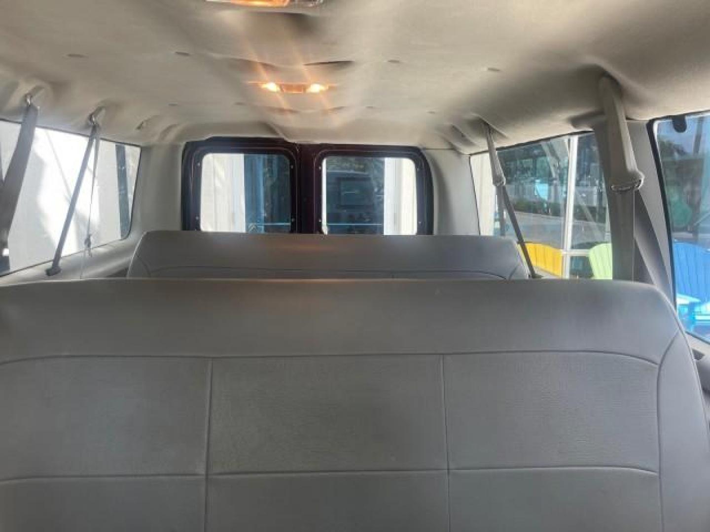 2006 Dark Toreador Red Metallic /Medium Flint Ford Econoline Wagon XLT 8 PASS LOW MILES 56290 (1FMRE11W06D) with an 4.6L EFI V8 Engine engine, Automatic transmission, located at 4701 North Dixie Hwy, Pompano Beach, FL, 33064, (954) 422-2889, 26.240938, -80.123474 - OUR WEBPAGE FLORIDACARS1.COM HAS OVER 100 PHOTOS AND FREE CARFAX LINK 2006 FORD E-SERIES E-150 XLT VIN: 1FMRE11W06DA64988 1 F M R E 1 1 W 0 6 D A 6 4 9 8 8 VAN 4.6L V8 F GASOLINE REAR WHEEL DRIVE Features ABS Brakes Air Conditioning AM/FM Stereo Automatic Transmission CD Audio Cruise Control Power L - Photo#67