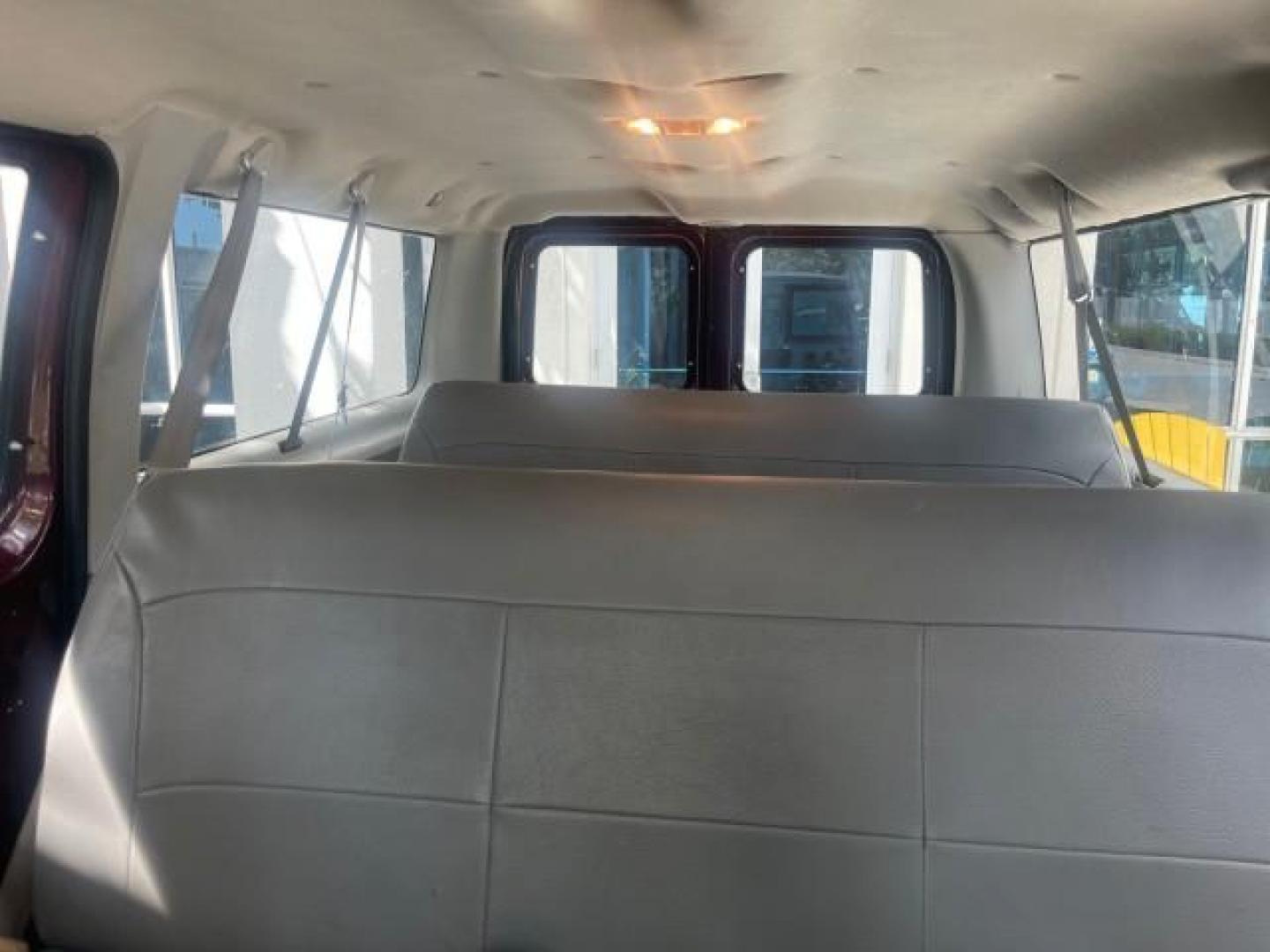 2006 Dark Toreador Red Metallic /Medium Flint Ford Econoline Wagon XLT 8 PASS LOW MILES 56290 (1FMRE11W06D) with an 4.6L EFI V8 Engine engine, Automatic transmission, located at 4701 North Dixie Hwy, Pompano Beach, FL, 33064, (954) 422-2889, 26.240938, -80.123474 - OUR WEBPAGE FLORIDACARS1.COM HAS OVER 100 PHOTOS AND FREE CARFAX LINK 2006 FORD E-SERIES E-150 XLT VIN: 1FMRE11W06DA64988 1 F M R E 1 1 W 0 6 D A 6 4 9 8 8 VAN 4.6L V8 F GASOLINE REAR WHEEL DRIVE Features ABS Brakes Air Conditioning AM/FM Stereo Automatic Transmission CD Audio Cruise Control Power L - Photo#68