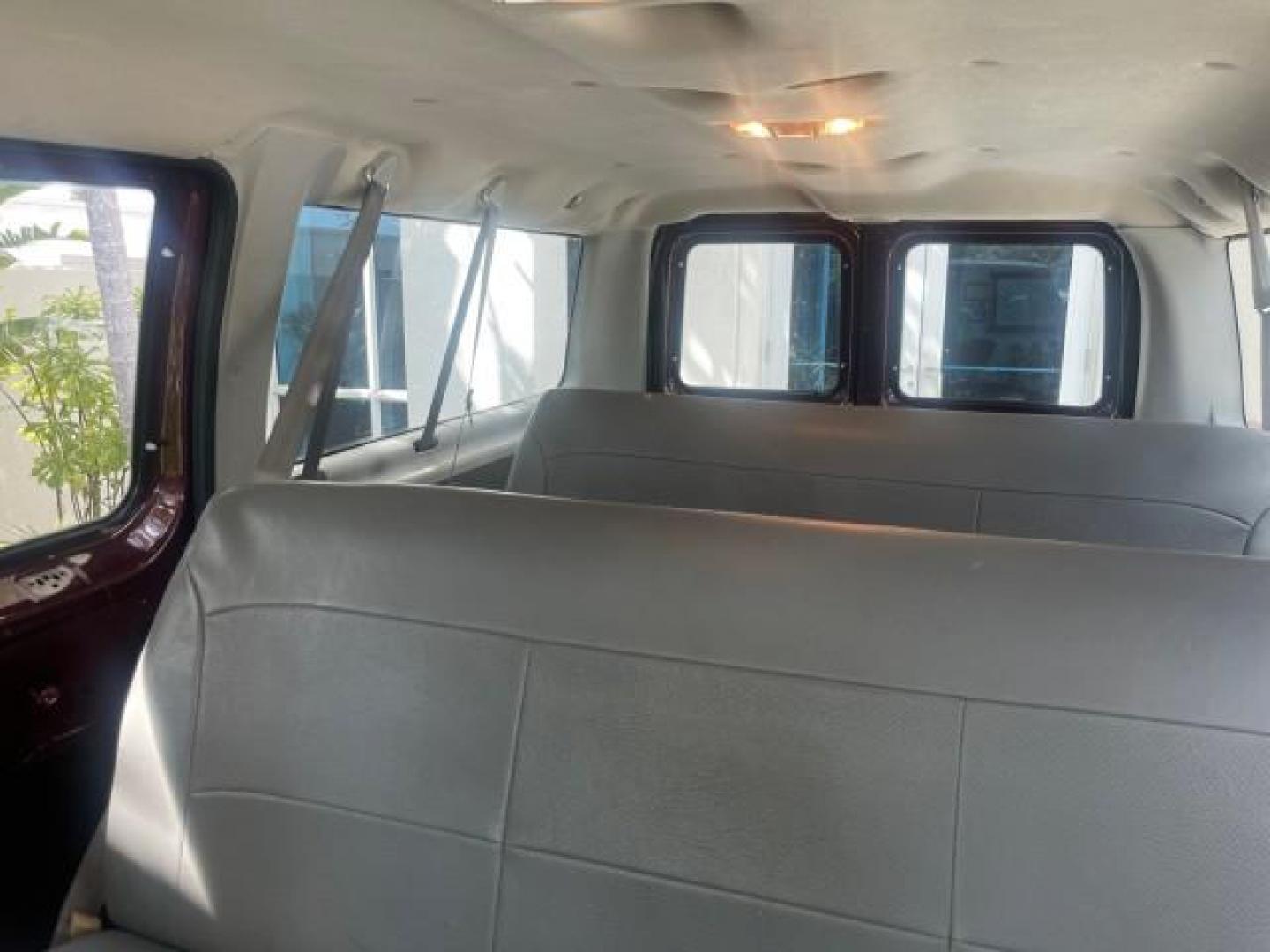 2006 Dark Toreador Red Metallic /Medium Flint Ford Econoline Wagon XLT 8 PASS LOW MILES 56290 (1FMRE11W06D) with an 4.6L EFI V8 Engine engine, Automatic transmission, located at 4701 North Dixie Hwy, Pompano Beach, FL, 33064, (954) 422-2889, 26.240938, -80.123474 - OUR WEBPAGE FLORIDACARS1.COM HAS OVER 100 PHOTOS AND FREE CARFAX LINK 2006 FORD E-SERIES E-150 XLT VIN: 1FMRE11W06DA64988 1 F M R E 1 1 W 0 6 D A 6 4 9 8 8 VAN 4.6L V8 F GASOLINE REAR WHEEL DRIVE Features ABS Brakes Air Conditioning AM/FM Stereo Automatic Transmission CD Audio Cruise Control Power L - Photo#69