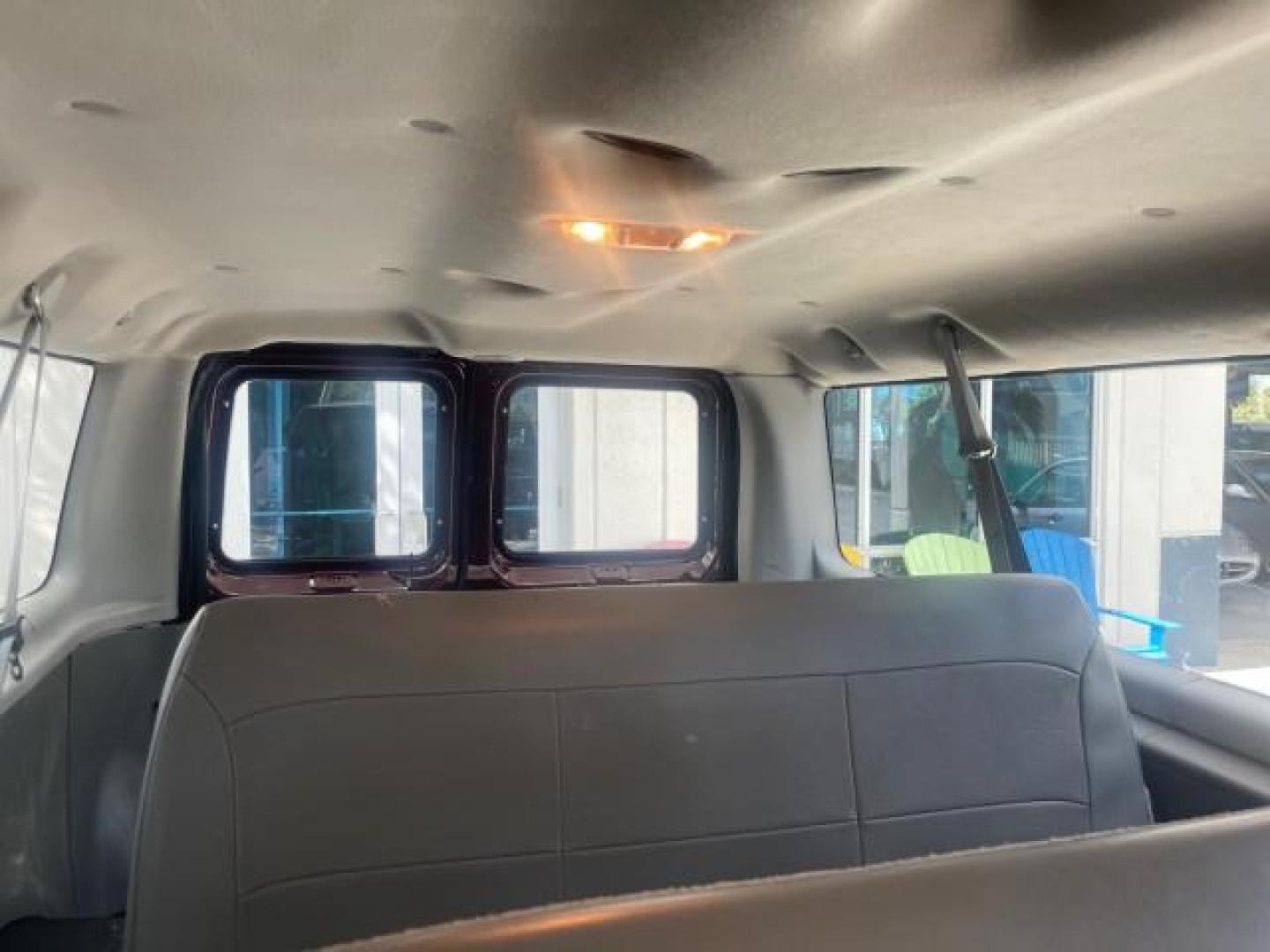 2006 Dark Toreador Red Metallic /Medium Flint Ford Econoline Wagon XLT 8 PASS LOW MILES 56290 (1FMRE11W06D) with an 4.6L EFI V8 Engine engine, Automatic transmission, located at 4701 North Dixie Hwy, Pompano Beach, FL, 33064, (954) 422-2889, 26.240938, -80.123474 - OUR WEBPAGE FLORIDACARS1.COM HAS OVER 100 PHOTOS AND FREE CARFAX LINK 2006 FORD E-SERIES E-150 XLT VIN: 1FMRE11W06DA64988 1 F M R E 1 1 W 0 6 D A 6 4 9 8 8 VAN 4.6L V8 F GASOLINE REAR WHEEL DRIVE Features ABS Brakes Air Conditioning AM/FM Stereo Automatic Transmission CD Audio Cruise Control Power L - Photo#71