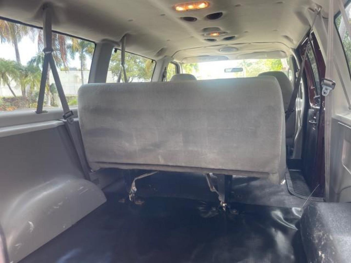 2006 Dark Toreador Red Metallic /Medium Flint Ford Econoline Wagon XLT 8 PASS LOW MILES 56290 (1FMRE11W06D) with an 4.6L EFI V8 Engine engine, Automatic transmission, located at 4701 North Dixie Hwy, Pompano Beach, FL, 33064, (954) 422-2889, 26.240938, -80.123474 - OUR WEBPAGE FLORIDACARS1.COM HAS OVER 100 PHOTOS AND FREE CARFAX LINK 2006 FORD E-SERIES E-150 XLT VIN: 1FMRE11W06DA64988 1 F M R E 1 1 W 0 6 D A 6 4 9 8 8 VAN 4.6L V8 F GASOLINE REAR WHEEL DRIVE Features ABS Brakes Air Conditioning AM/FM Stereo Automatic Transmission CD Audio Cruise Control Power L - Photo#91