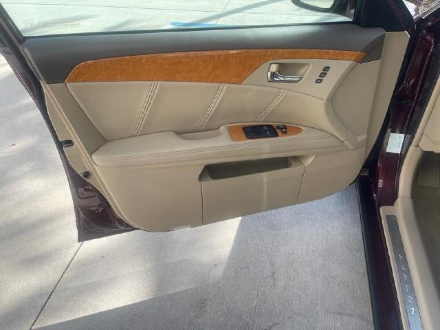 2006 Cassis Pearl /Ivory Toyota Avalon Limited 1 OWNER FL LOW MILES 49391 (4T1BK36B36U) with an 3.5L 24-Valve EFI DOHC V6 Engine engine, Automatic transmission, located at 4701 North Dixie Hwy, Pompano Beach, FL, 33064, (954) 422-2889, 26.240938, -80.123474 - OUR WEBPAGE FLORIDACARS1.COM HAS OVER 100 PHOTOS AND FREE CARFAX LINK 2006 TOYOTA AVALON LIMITED VIN: 4T1BK36B36U142787 4 T 1 B K 3 6 B 3 6 U 1 4 2 7 8 7 SEDAN 4 DR 3.5L V6 F DOHC 24V GASOLINE 31 MPG FRONT WHEEL DRIVE Features ABS Brakes Air Conditioning Alloy Wheels AM/FM Stereo Automatic Transmiss - Photo#41