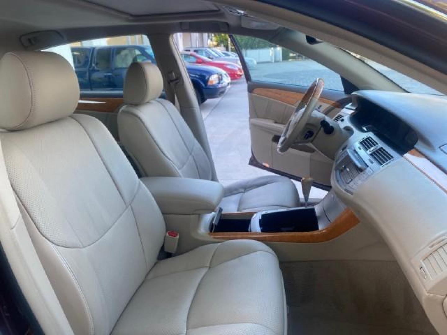 2006 Cassis Pearl /Ivory Toyota Avalon Limited 1 OWNER FL LOW MILES 49391 (4T1BK36B36U) with an 3.5L 24-Valve EFI DOHC V6 Engine engine, Automatic transmission, located at 4701 North Dixie Hwy, Pompano Beach, FL, 33064, (954) 422-2889, 26.240938, -80.123474 - OUR WEBPAGE FLORIDACARS1.COM HAS OVER 100 PHOTOS AND FREE CARFAX LINK 2006 TOYOTA AVALON LIMITED VIN: 4T1BK36B36U142787 4 T 1 B K 3 6 B 3 6 U 1 4 2 7 8 7 SEDAN 4 DR 3.5L V6 F DOHC 24V GASOLINE 31 MPG FRONT WHEEL DRIVE Features ABS Brakes Air Conditioning Alloy Wheels AM/FM Stereo Automatic Transmiss - Photo#12