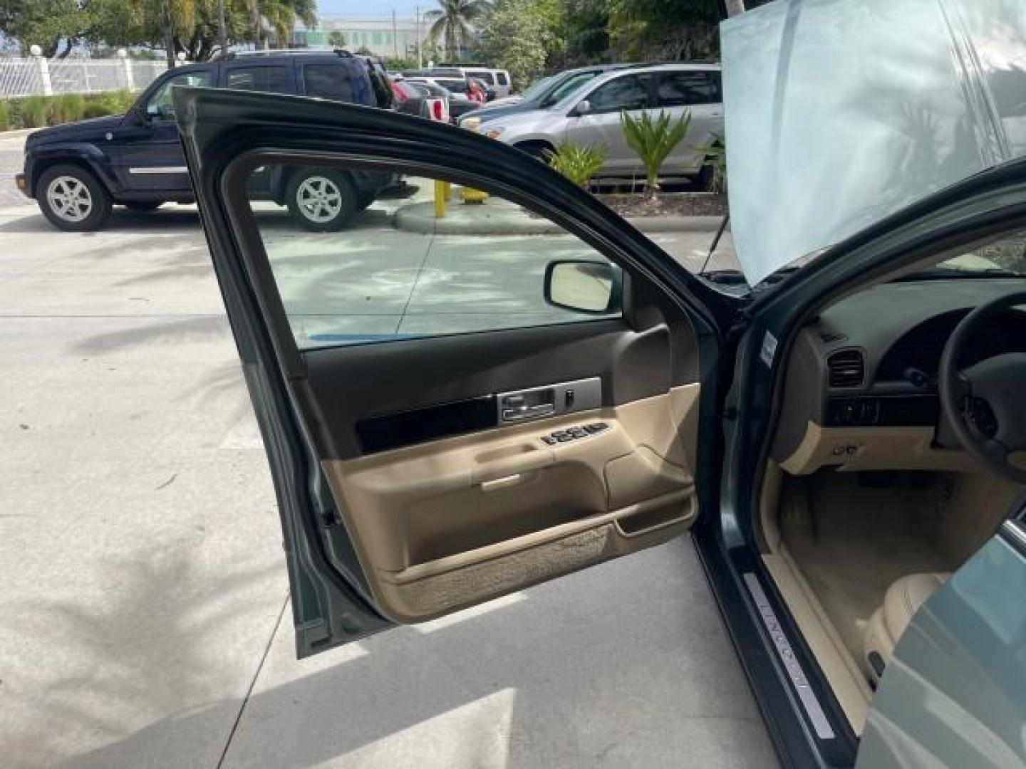 2005 Norsea Blue Metallic /Stone/Camel Lincoln LS LOW MILES 49882 1 OWNER FLORIDA (1LNHM86S05Y) with an 3.0L DOHC EFI 24-Valve V6 Engine engine, Automatic transmission, located at 4701 North Dixie Hwy, Pompano Beach, FL, 33064, (954) 422-2889, 26.240938, -80.123474 - OUR WEBPAGE FLORIDACARS1.COM HAS OVER 100 PHOTOS AND FREE CARFAX LINK 2005 LINCOLN LS LUXURY VIN: 1LNHM86S05Y614694 1 L N H M 8 6 S 0 5 Y 6 1 4 6 9 4 SEDAN 4 DR 3.0L V6 F DOHC GASOLINE REAR WHEEL DRIVE Features ABS Brakes Air Conditioning Alloy Wheels AM/FM Stereo Automatic Transmission Cassette Pla - Photo#9