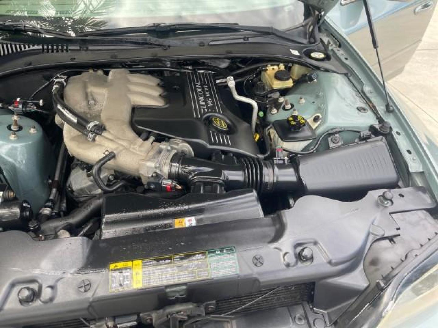 2005 Norsea Blue Metallic /Stone/Camel Lincoln LS LOW MILES 49882 1 OWNER FLORIDA (1LNHM86S05Y) with an 3.0L DOHC EFI 24-Valve V6 Engine engine, Automatic transmission, located at 4701 North Dixie Hwy, Pompano Beach, FL, 33064, (954) 422-2889, 26.240938, -80.123474 - OUR WEBPAGE FLORIDACARS1.COM HAS OVER 100 PHOTOS AND FREE CARFAX LINK 2005 LINCOLN LS LUXURY VIN: 1LNHM86S05Y614694 1 L N H M 8 6 S 0 5 Y 6 1 4 6 9 4 SEDAN 4 DR 3.0L V6 F DOHC GASOLINE REAR WHEEL DRIVE Features ABS Brakes Air Conditioning Alloy Wheels AM/FM Stereo Automatic Transmission Cassette Pla - Photo#26