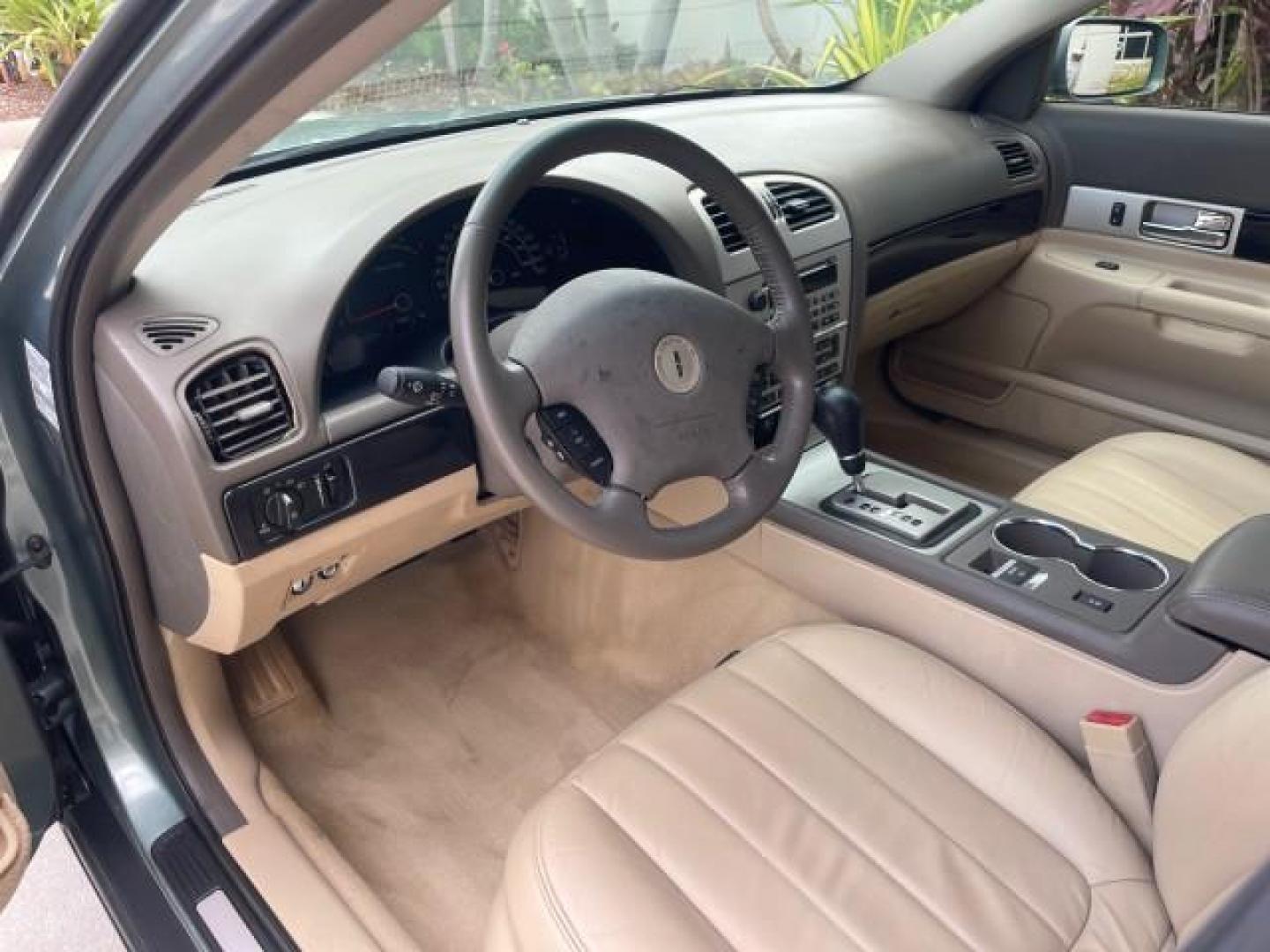 2005 Norsea Blue Metallic /Stone/Camel Lincoln LS LOW MILES 49882 1 OWNER FLORIDA (1LNHM86S05Y) with an 3.0L DOHC EFI 24-Valve V6 Engine engine, Automatic transmission, located at 4701 North Dixie Hwy, Pompano Beach, FL, 33064, (954) 422-2889, 26.240938, -80.123474 - OUR WEBPAGE FLORIDACARS1.COM HAS OVER 100 PHOTOS AND FREE CARFAX LINK 2005 LINCOLN LS LUXURY VIN: 1LNHM86S05Y614694 1 L N H M 8 6 S 0 5 Y 6 1 4 6 9 4 SEDAN 4 DR 3.0L V6 F DOHC GASOLINE REAR WHEEL DRIVE Features ABS Brakes Air Conditioning Alloy Wheels AM/FM Stereo Automatic Transmission Cassette Pla - Photo#49