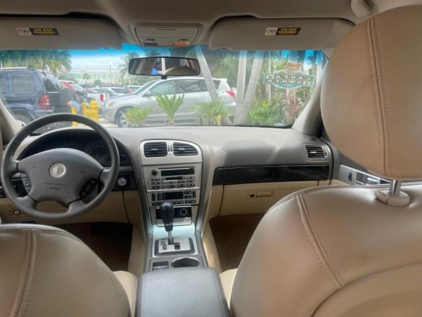2005 Norsea Blue Metallic /Stone/Camel Lincoln LS LOW MILES 49882 1 OWNER FLORIDA (1LNHM86S05Y) with an 3.0L DOHC EFI 24-Valve V6 Engine engine, Automatic transmission, located at 4701 North Dixie Hwy, Pompano Beach, FL, 33064, (954) 422-2889, 26.240938, -80.123474 - OUR WEBPAGE FLORIDACARS1.COM HAS OVER 100 PHOTOS AND FREE CARFAX LINK 2005 LINCOLN LS LUXURY VIN: 1LNHM86S05Y614694 1 L N H M 8 6 S 0 5 Y 6 1 4 6 9 4 SEDAN 4 DR 3.0L V6 F DOHC GASOLINE REAR WHEEL DRIVE Features ABS Brakes Air Conditioning Alloy Wheels AM/FM Stereo Automatic Transmission Cassette Pla - Photo#80