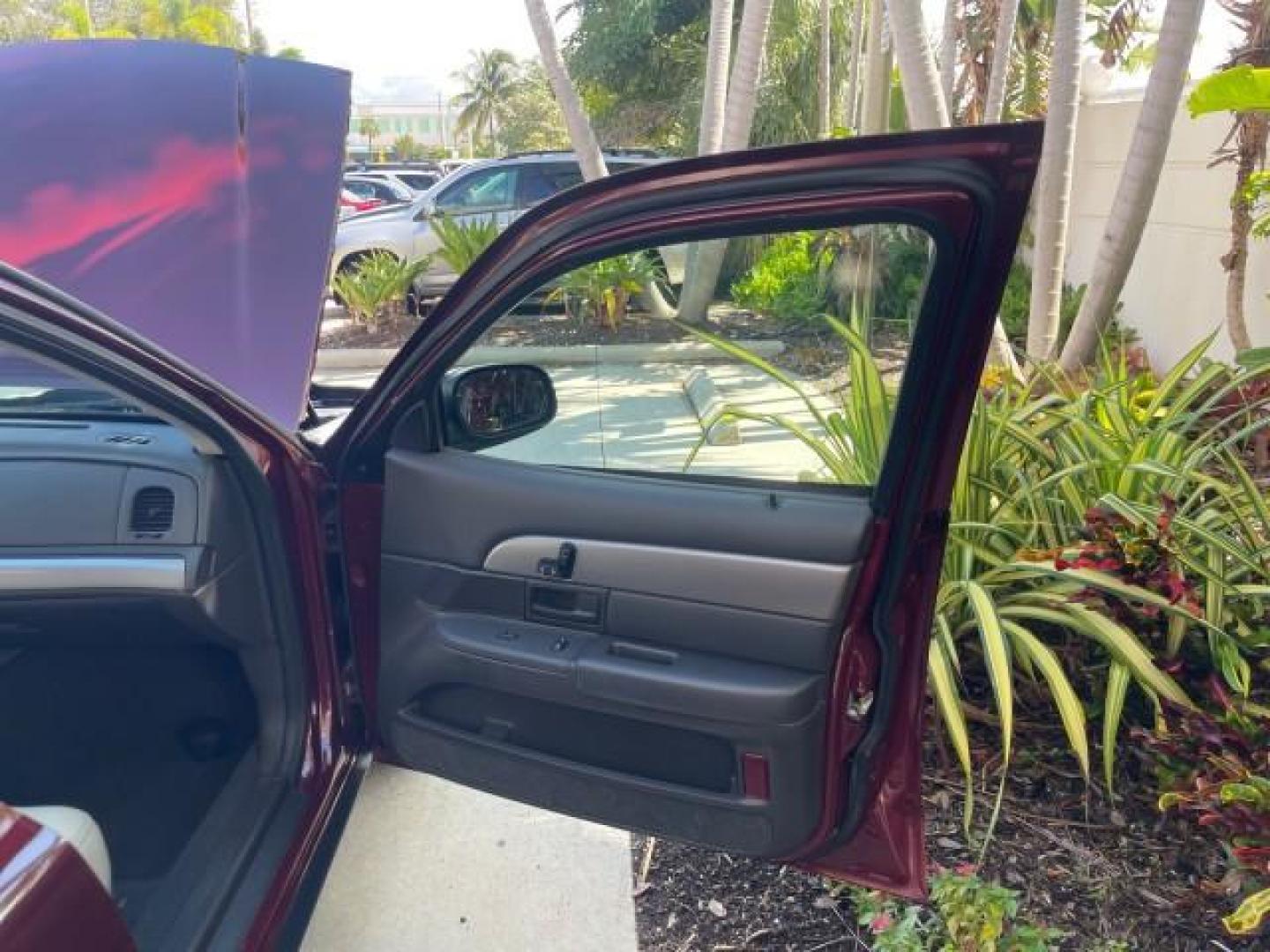 2004 Dark Toreador Red Metallic /Light Flint Mercury Marauder COBRA V 8 DUAL OVER HEAD CAM LOW MILES 21,997 (2MEHM79V94X) with an 4.6L DOHC SEFI 32-Valve V8 All-Aluminum Engine engine, Automatic transmission, located at 4701 North Dixie Hwy, Pompano Beach, FL, 33064, (954) 422-2889, 26.240938, -80.123474 - OUR WEBPAGE FLORIDACARS1.COM HAS OVER 100 PHOTOS AND FREE CARFAX LINK 2004 MERCURY MARAUDER VIN: 2MEHM79V94X671770 2 M E H M 7 9 V 9 4 X 6 7 1 7 7 0 SEDAN 4 DR 4.6L V8 F DOHC GASOLINE REAR WHEEL DRIVE Features ABS Brakes Air Conditioning Alloy Wheels AM/FM Stereo Audiophile Sound System Automatic Tr - Photo#11