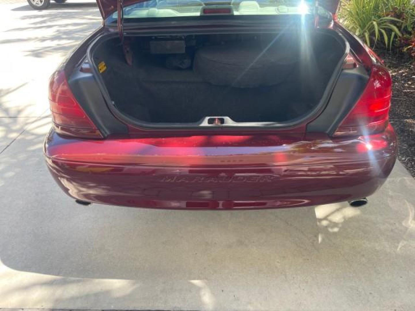 2004 Dark Toreador Red Metallic /Light Flint Mercury Marauder COBRA V 8 DUAL OVER HEAD CAM LOW MILES 21,997 (2MEHM79V94X) with an 4.6L DOHC SEFI 32-Valve V8 All-Aluminum Engine engine, Automatic transmission, located at 4701 North Dixie Hwy, Pompano Beach, FL, 33064, (954) 422-2889, 26.240938, -80.123474 - OUR WEBPAGE FLORIDACARS1.COM HAS OVER 100 PHOTOS AND FREE CARFAX LINK 2004 MERCURY MARAUDER VIN: 2MEHM79V94X671770 2 M E H M 7 9 V 9 4 X 6 7 1 7 7 0 SEDAN 4 DR 4.6L V8 F DOHC GASOLINE REAR WHEEL DRIVE Features ABS Brakes Air Conditioning Alloy Wheels AM/FM Stereo Audiophile Sound System Automatic Tr - Photo#86