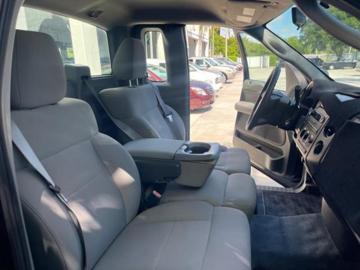 2007 Black /Flint Ford F-150 STX LOW 41,792 1 OWNER (1FTRF12247K) with an 4.2L EFI V6 Engine engine, Automatic transmission, located at 4701 North Dixie Hwy, Pompano Beach, FL, 33064, (954) 422-2889, 26.240938, -80.123474 - OUR WEBPAGE FLORIDACARS1.COM HAS OVER 100 PHOTOS AND FREE CARFAX LINK 2007 FORD F-150 XL LONG BED 8 FT VIN: 1FTRF12247KD38557 1 F T R F 1 2 2 4 7 K D 3 8 5 5 7 PICKUP 4.2L V6 F GASOLINE REAR WHEEL DRIVE Features ABS Brakes Air Conditioning Alloy Wheels AM/FM Stereo Automatic Transmission Auxiliary A - Photo#12