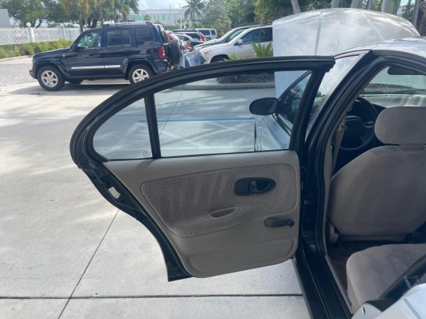 2002 Light Silver /Grey Saturn SL2 LOW MILES 51,437 1 OWNER FLORIDA (1G8ZK54782Z) with an 1.9L DOHC SPFI 16-Valve L4 Aluminum Engine engine, Automatic transmission, located at 4701 North Dixie Hwy, Pompano Beach, FL, 33064, (954) 422-2889, 26.240938, -80.123474 - OUR WEBPAGE FLORIDACARS1.COM HAS OVER 100 PHOTOS AND FREE CARFAX LINK 2002 SATURN S-SERIES SL2 VIN: 1G8ZK54782Z312050 1 G 8 Z K 5 4 7 8 2 Z 3 1 2 0 5 0 SEDAN 4 DR 1.9L I4 F DOHC 16V GASOLINE FRONT WHEEL DRIVE Features Air Conditioning AM/FM Stereo Automatic Transmission Cloth Seats Rear Defroster Pr - Photo#13