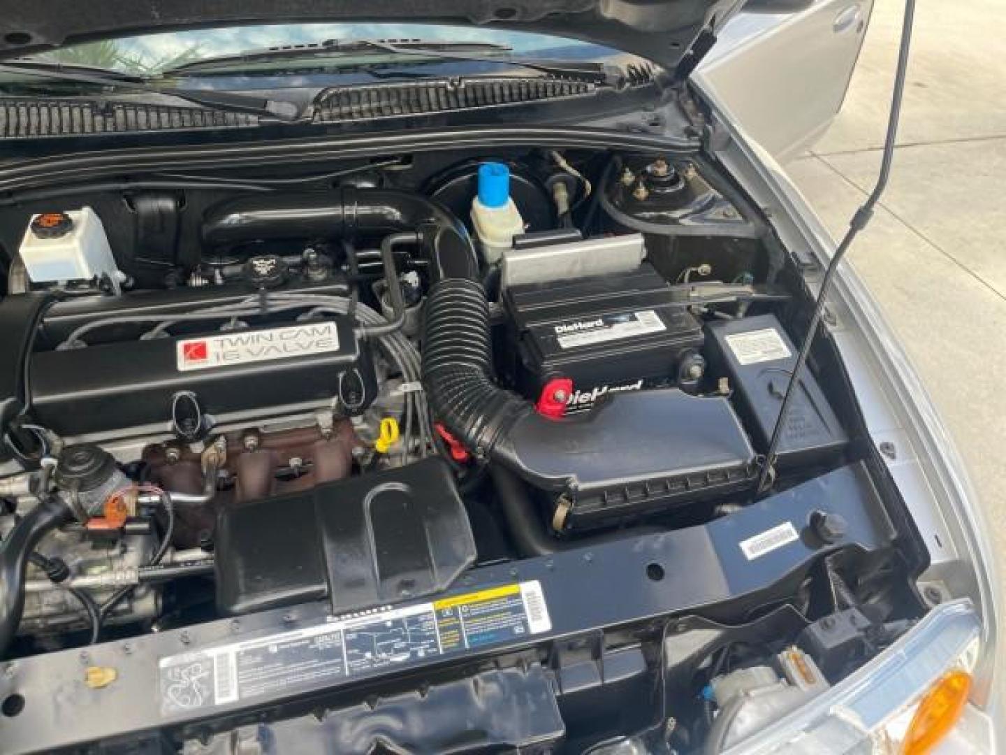 2002 Light Silver /Grey Saturn SL2 LOW MILES 51,437 1 OWNER FLORIDA (1G8ZK54782Z) with an 1.9L DOHC SPFI 16-Valve L4 Aluminum Engine engine, Automatic transmission, located at 4701 North Dixie Hwy, Pompano Beach, FL, 33064, (954) 422-2889, 26.240938, -80.123474 - OUR WEBPAGE FLORIDACARS1.COM HAS OVER 100 PHOTOS AND FREE CARFAX LINK 2002 SATURN S-SERIES SL2 VIN: 1G8ZK54782Z312050 1 G 8 Z K 5 4 7 8 2 Z 3 1 2 0 5 0 SEDAN 4 DR 1.9L I4 F DOHC 16V GASOLINE FRONT WHEEL DRIVE Features Air Conditioning AM/FM Stereo Automatic Transmission Cloth Seats Rear Defroster Pr - Photo#26