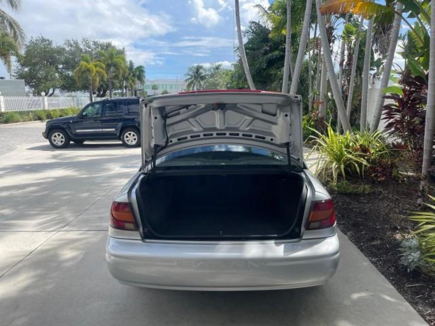 2002 Light Silver /Grey Saturn SL2 LOW MILES 51,437 1 OWNER FLORIDA (1G8ZK54782Z) with an 1.9L DOHC SPFI 16-Valve L4 Aluminum Engine engine, Automatic transmission, located at 4701 North Dixie Hwy, Pompano Beach, FL, 33064, (954) 422-2889, 26.240938, -80.123474 - OUR WEBPAGE FLORIDACARS1.COM HAS OVER 100 PHOTOS AND FREE CARFAX LINK 2002 SATURN S-SERIES SL2 VIN: 1G8ZK54782Z312050 1 G 8 Z K 5 4 7 8 2 Z 3 1 2 0 5 0 SEDAN 4 DR 1.9L I4 F DOHC 16V GASOLINE FRONT WHEEL DRIVE Features Air Conditioning AM/FM Stereo Automatic Transmission Cloth Seats Rear Defroster Pr - Photo#86