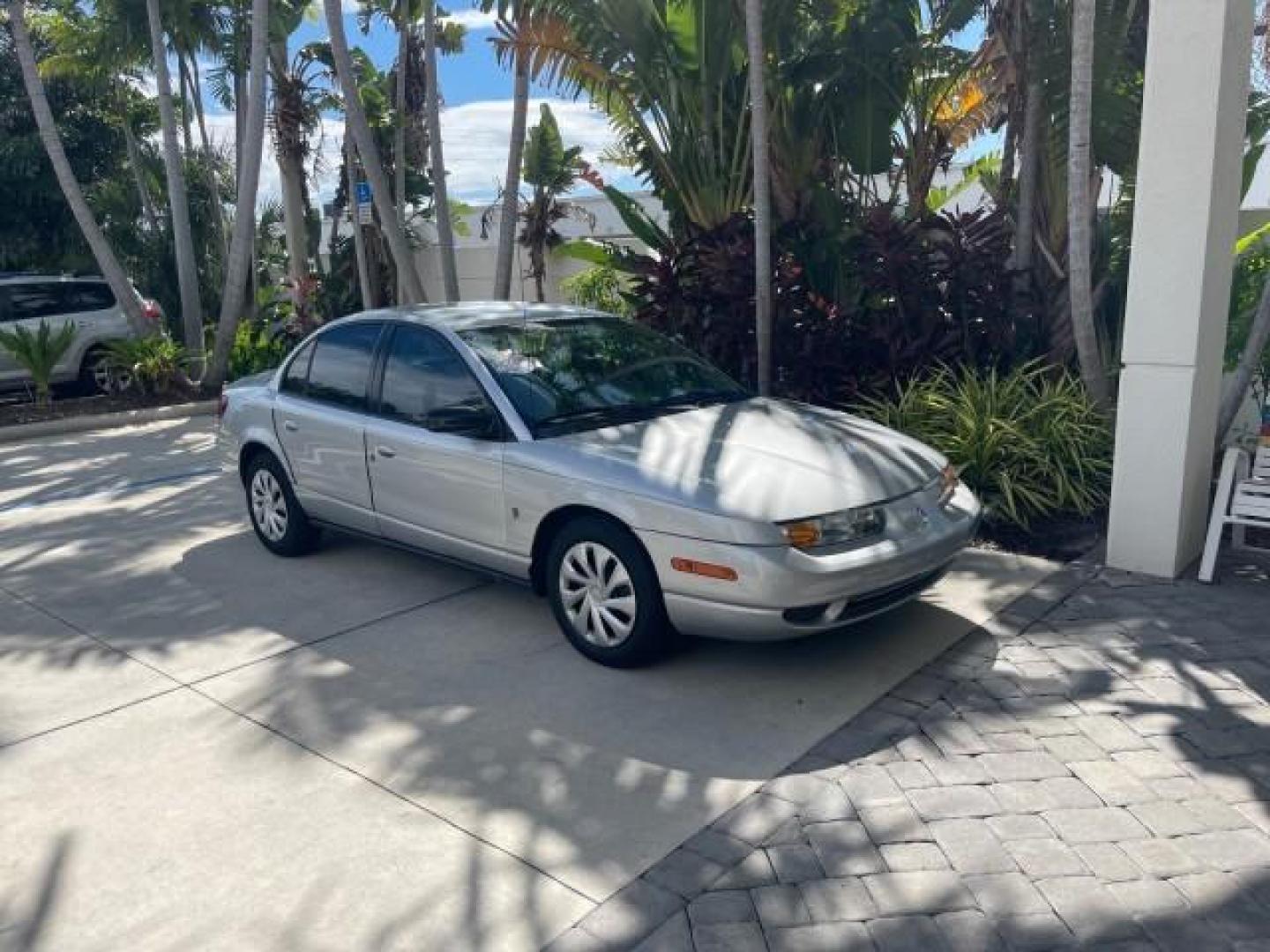 2002 Light Silver /Grey Saturn SL2 LOW MILES 51,437 1 OWNER FLORIDA (1G8ZK54782Z) with an 1.9L DOHC SPFI 16-Valve L4 Aluminum Engine engine, Automatic transmission, located at 4701 North Dixie Hwy, Pompano Beach, FL, 33064, (954) 422-2889, 26.240938, -80.123474 - OUR WEBPAGE FLORIDACARS1.COM HAS OVER 100 PHOTOS AND FREE CARFAX LINK 2002 SATURN S-SERIES SL2 VIN: 1G8ZK54782Z312050 1 G 8 Z K 5 4 7 8 2 Z 3 1 2 0 5 0 SEDAN 4 DR 1.9L I4 F DOHC 16V GASOLINE FRONT WHEEL DRIVE Features Air Conditioning AM/FM Stereo Automatic Transmission Cloth Seats Rear Defroster Pr - Photo#95