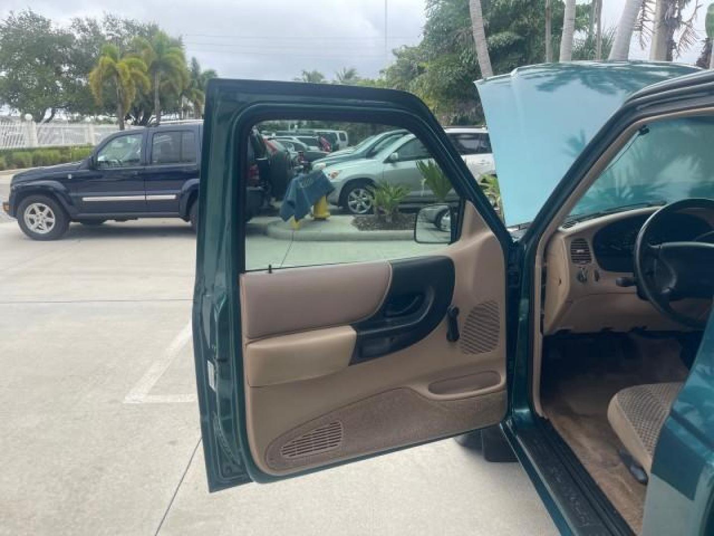 1998 Deep Emerald Green (CC/Met) /Medium Graphite Ford Ranger XL LOW MILES 4 CYL LOW MILES (1FTYR10C0WP) with an 2.5L EFI 4-Cyl Engine engine, Automatic transmission, located at 4701 North Dixie Hwy, Pompano Beach, FL, 33064, (954) 422-2889, 26.240938, -80.123474 - OUR WEBPAGE FLORIDACARS1.COM HAS OVER 100 PHOTOS AND FREE CARFAX LINK 1998 FORD RANGER SPLASH FLARESIDE VIN: 1FTYR10C0WPA84443 1 F T Y R 1 0 C 0 W P A 8 4 4 4 3 PICKUP 2.5L I4 F SOHC 8V GASOLINE 27 MPG REAR WHEEL DRIVE Features ABS Brakes Automatic Transmission Cassette Player Cloth Seats Ice Cold A - Photo#9