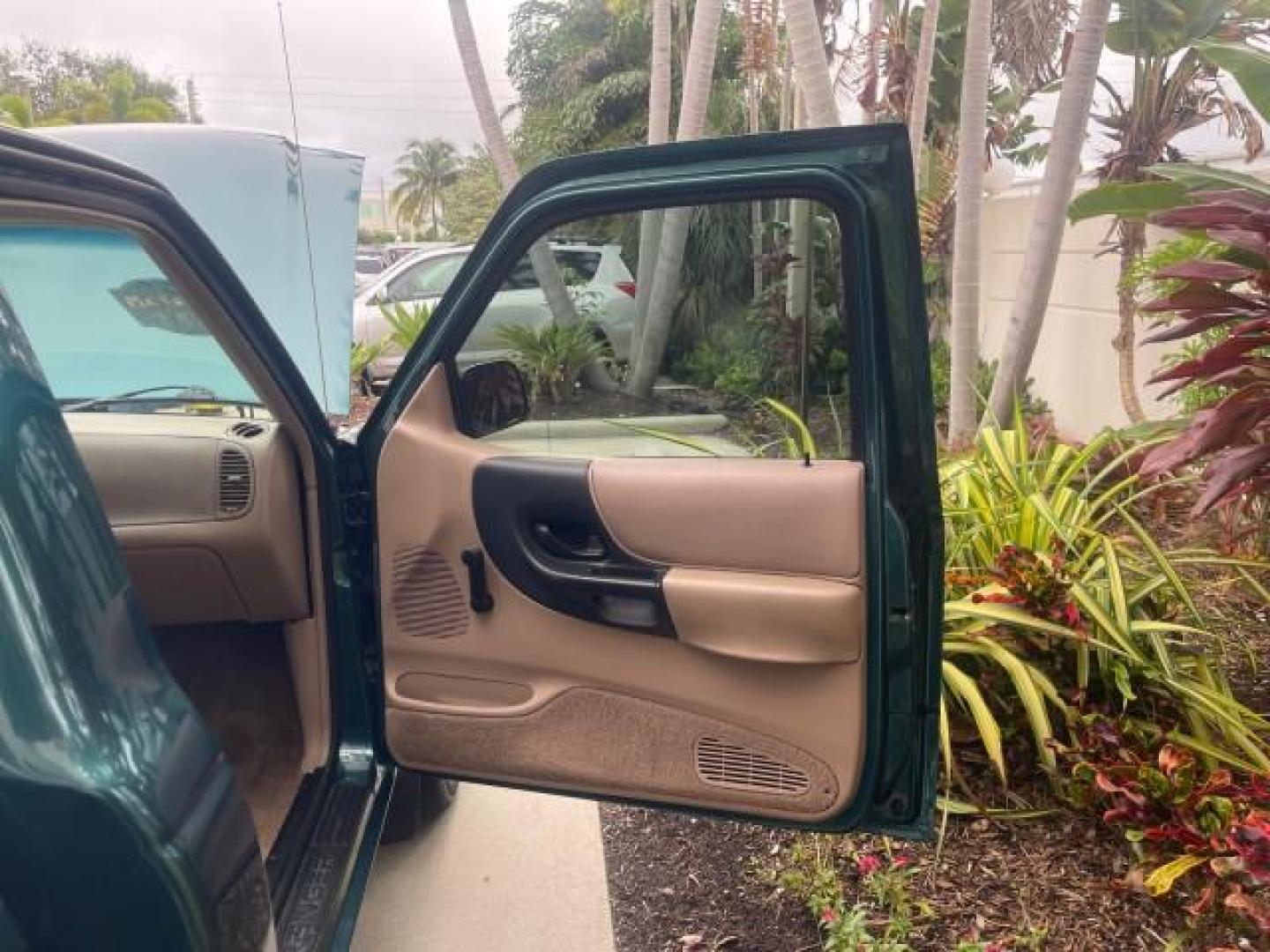 1998 Deep Emerald Green (CC/Met) /Medium Graphite Ford Ranger XL LOW MILES 4 CYL LOW MILES (1FTYR10C0WP) with an 2.5L EFI 4-Cyl Engine engine, Automatic transmission, located at 4701 North Dixie Hwy, Pompano Beach, FL, 33064, (954) 422-2889, 26.240938, -80.123474 - OUR WEBPAGE FLORIDACARS1.COM HAS OVER 100 PHOTOS AND FREE CARFAX LINK 1998 FORD RANGER SPLASH FLARESIDE VIN: 1FTYR10C0WPA84443 1 F T Y R 1 0 C 0 W P A 8 4 4 4 3 PICKUP 2.5L I4 F SOHC 8V GASOLINE 27 MPG REAR WHEEL DRIVE Features ABS Brakes Automatic Transmission Cassette Player Cloth Seats Ice Cold A - Photo#11
