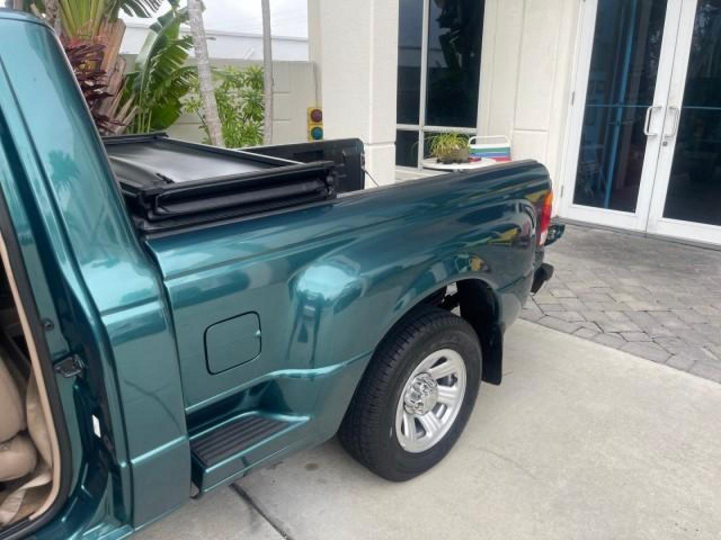 1998 Deep Emerald Green (CC/Met) /Medium Graphite Ford Ranger XL LOW MILES 4 CYL LOW MILES (1FTYR10C0WP) with an 2.5L EFI 4-Cyl Engine engine, Automatic transmission, located at 4701 North Dixie Hwy, Pompano Beach, FL, 33064, (954) 422-2889, 26.240938, -80.123474 - OUR WEBPAGE FLORIDACARS1.COM HAS OVER 100 PHOTOS AND FREE CARFAX LINK 1998 FORD RANGER SPLASH FLARESIDE VIN: 1FTYR10C0WPA84443 1 F T Y R 1 0 C 0 W P A 8 4 4 4 3 PICKUP 2.5L I4 F SOHC 8V GASOLINE 27 MPG REAR WHEEL DRIVE Features ABS Brakes Automatic Transmission Cassette Player Cloth Seats Ice Cold A - Photo#13