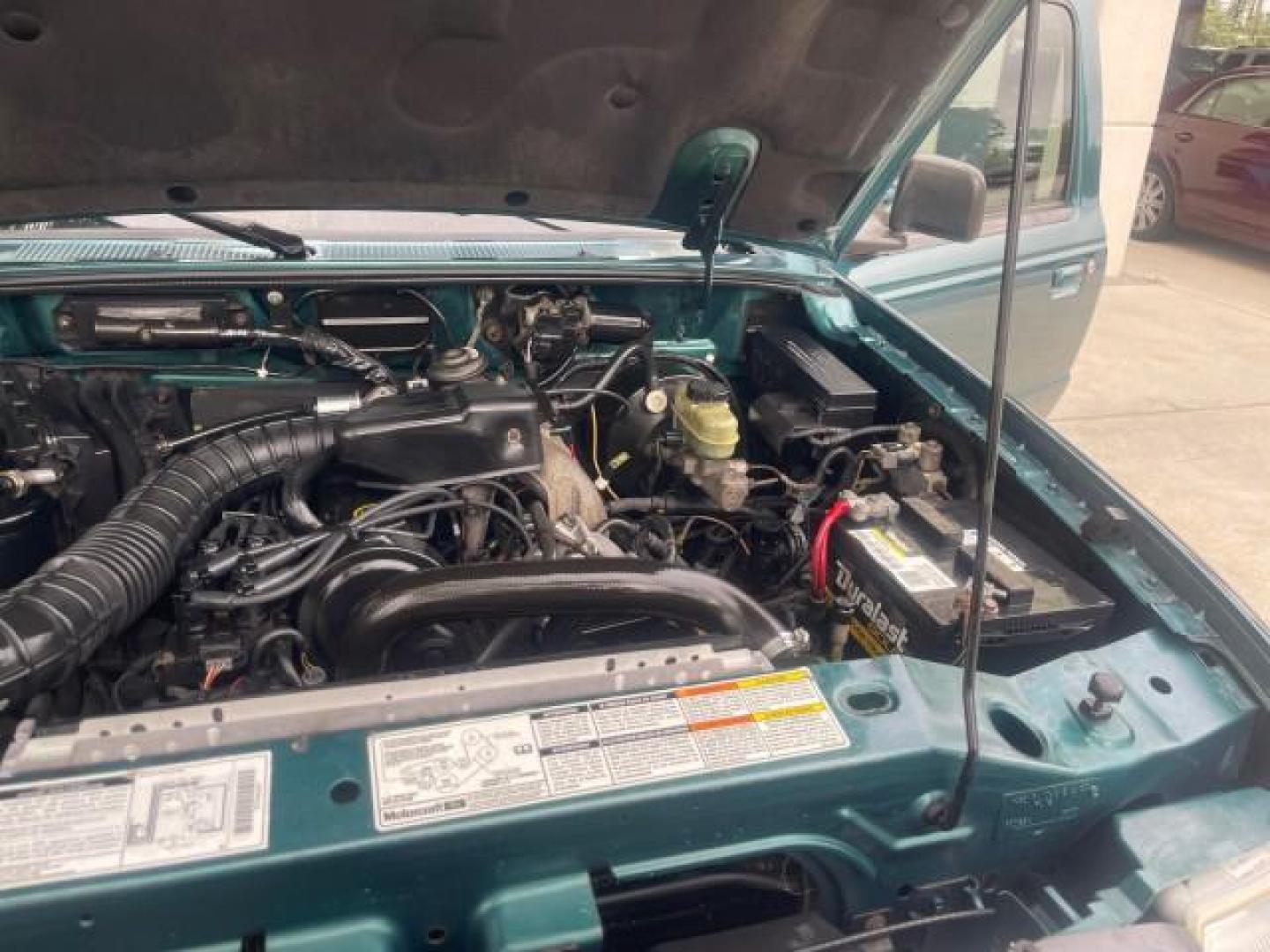 1998 Deep Emerald Green (CC/Met) /Medium Graphite Ford Ranger XL LOW MILES 4 CYL LOW MILES (1FTYR10C0WP) with an 2.5L EFI 4-Cyl Engine engine, Automatic transmission, located at 4701 North Dixie Hwy, Pompano Beach, FL, 33064, (954) 422-2889, 26.240938, -80.123474 - OUR WEBPAGE FLORIDACARS1.COM HAS OVER 100 PHOTOS AND FREE CARFAX LINK 1998 FORD RANGER SPLASH FLARESIDE VIN: 1FTYR10C0WPA84443 1 F T Y R 1 0 C 0 W P A 8 4 4 4 3 PICKUP 2.5L I4 F SOHC 8V GASOLINE 27 MPG REAR WHEEL DRIVE Features ABS Brakes Automatic Transmission Cassette Player Cloth Seats Ice Cold A - Photo#26