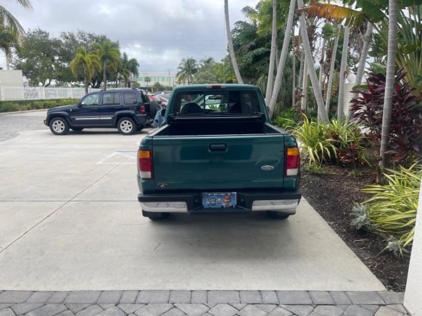 1998 Deep Emerald Green (CC/Met) /Medium Graphite Ford Ranger XL LOW MILES 4 CYL LOW MILES (1FTYR10C0WP) with an 2.5L EFI 4-Cyl Engine engine, Automatic transmission, located at 4701 North Dixie Hwy, Pompano Beach, FL, 33064, (954) 422-2889, 26.240938, -80.123474 - OUR WEBPAGE FLORIDACARS1.COM HAS OVER 100 PHOTOS AND FREE CARFAX LINK 1998 FORD RANGER SPLASH FLARESIDE VIN: 1FTYR10C0WPA84443 1 F T Y R 1 0 C 0 W P A 8 4 4 4 3 PICKUP 2.5L I4 F SOHC 8V GASOLINE 27 MPG REAR WHEEL DRIVE Features ABS Brakes Automatic Transmission Cassette Player Cloth Seats Ice Cold A - Photo#35