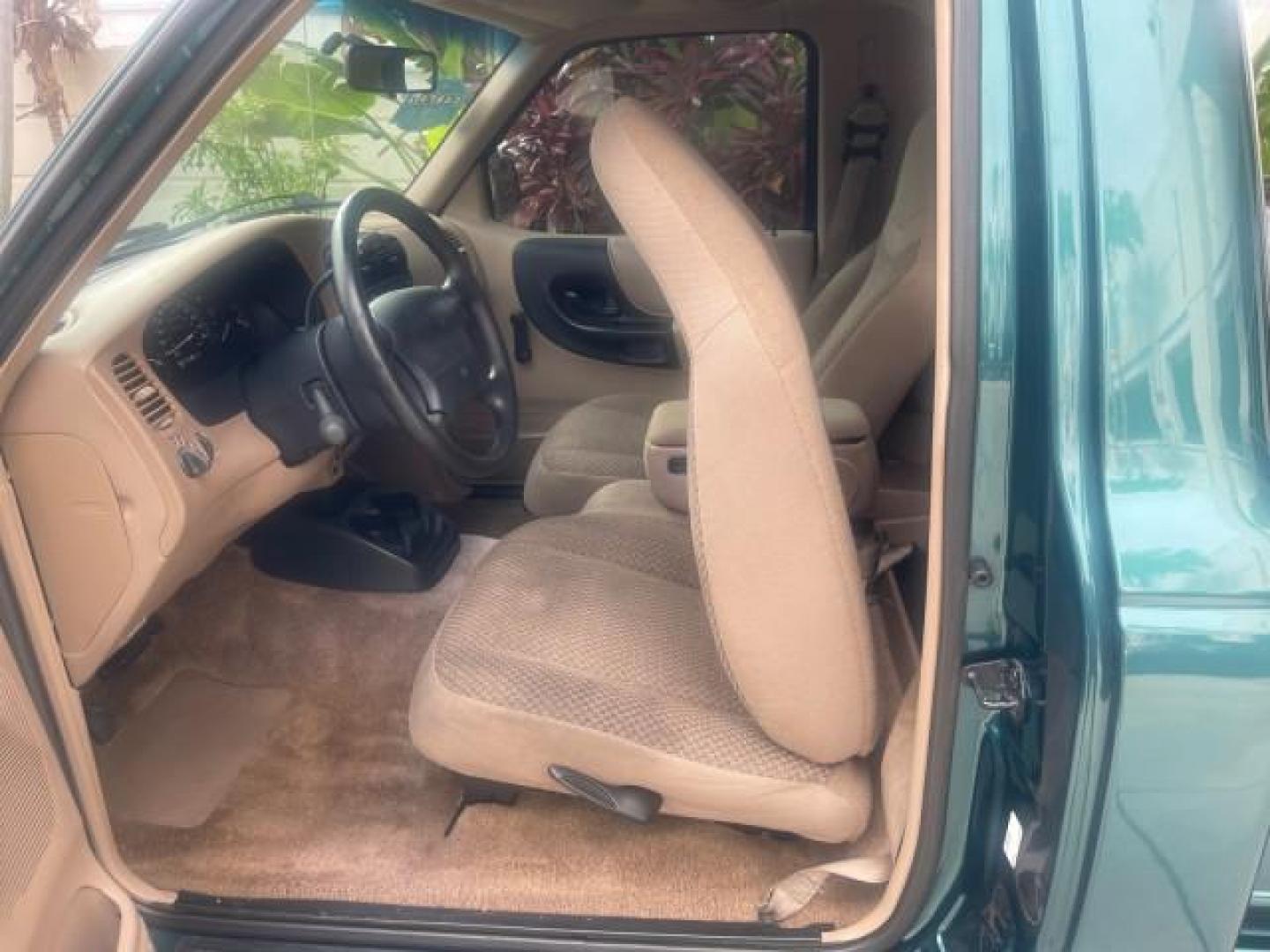 1998 Deep Emerald Green (CC/Met) /Medium Graphite Ford Ranger XL LOW MILES 4 CYL LOW MILES (1FTYR10C0WP) with an 2.5L EFI 4-Cyl Engine engine, Automatic transmission, located at 4701 North Dixie Hwy, Pompano Beach, FL, 33064, (954) 422-2889, 26.240938, -80.123474 - OUR WEBPAGE FLORIDACARS1.COM HAS OVER 100 PHOTOS AND FREE CARFAX LINK 1998 FORD RANGER SPLASH FLARESIDE VIN: 1FTYR10C0WPA84443 1 F T Y R 1 0 C 0 W P A 8 4 4 4 3 PICKUP 2.5L I4 F SOHC 8V GASOLINE 27 MPG REAR WHEEL DRIVE Features ABS Brakes Automatic Transmission Cassette Player Cloth Seats Ice Cold A - Photo#66