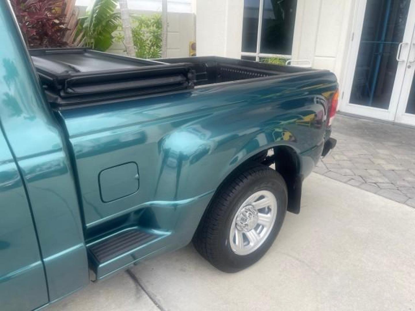 1998 Deep Emerald Green (CC/Met) /Medium Graphite Ford Ranger XL LOW MILES 4 CYL LOW MILES (1FTYR10C0WP) with an 2.5L EFI 4-Cyl Engine engine, Automatic transmission, located at 4701 North Dixie Hwy, Pompano Beach, FL, 33064, (954) 422-2889, 26.240938, -80.123474 - OUR WEBPAGE FLORIDACARS1.COM HAS OVER 100 PHOTOS AND FREE CARFAX LINK 1998 FORD RANGER SPLASH FLARESIDE VIN: 1FTYR10C0WPA84443 1 F T Y R 1 0 C 0 W P A 8 4 4 4 3 PICKUP 2.5L I4 F SOHC 8V GASOLINE 27 MPG REAR WHEEL DRIVE Features ABS Brakes Automatic Transmission Cassette Player Cloth Seats Ice Cold A - Photo#69