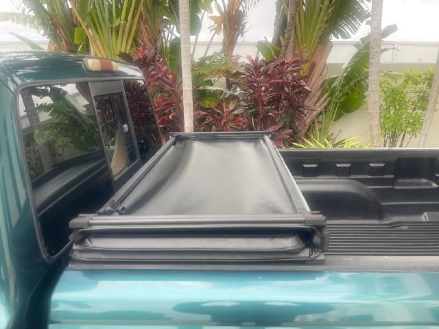 1998 Deep Emerald Green (CC/Met) /Medium Graphite Ford Ranger XL LOW MILES 4 CYL LOW MILES (1FTYR10C0WP) with an 2.5L EFI 4-Cyl Engine engine, Automatic transmission, located at 4701 North Dixie Hwy, Pompano Beach, FL, 33064, (954) 422-2889, 26.240938, -80.123474 - OUR WEBPAGE FLORIDACARS1.COM HAS OVER 100 PHOTOS AND FREE CARFAX LINK 1998 FORD RANGER SPLASH FLARESIDE VIN: 1FTYR10C0WPA84443 1 F T Y R 1 0 C 0 W P A 8 4 4 4 3 PICKUP 2.5L I4 F SOHC 8V GASOLINE 27 MPG REAR WHEEL DRIVE Features ABS Brakes Automatic Transmission Cassette Player Cloth Seats Ice Cold A - Photo#74