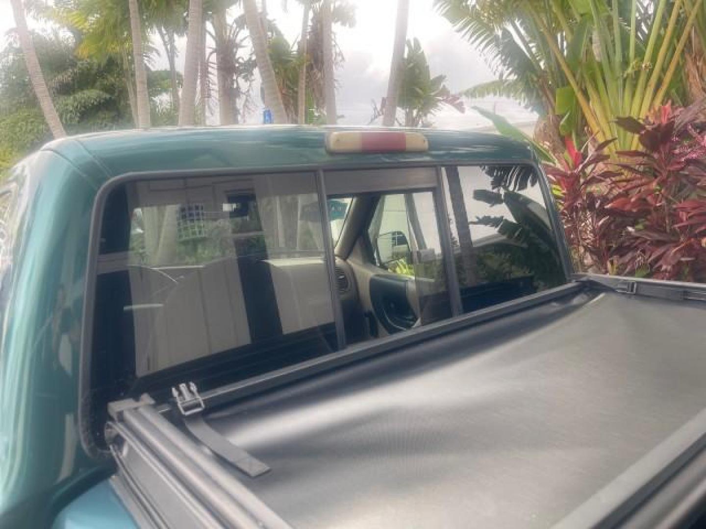 1998 Deep Emerald Green (CC/Met) /Medium Graphite Ford Ranger XL LOW MILES 4 CYL LOW MILES (1FTYR10C0WP) with an 2.5L EFI 4-Cyl Engine engine, Automatic transmission, located at 4701 North Dixie Hwy, Pompano Beach, FL, 33064, (954) 422-2889, 26.240938, -80.123474 - OUR WEBPAGE FLORIDACARS1.COM HAS OVER 100 PHOTOS AND FREE CARFAX LINK 1998 FORD RANGER SPLASH FLARESIDE VIN: 1FTYR10C0WPA84443 1 F T Y R 1 0 C 0 W P A 8 4 4 4 3 PICKUP 2.5L I4 F SOHC 8V GASOLINE 27 MPG REAR WHEEL DRIVE Features ABS Brakes Automatic Transmission Cassette Player Cloth Seats Ice Cold A - Photo#75