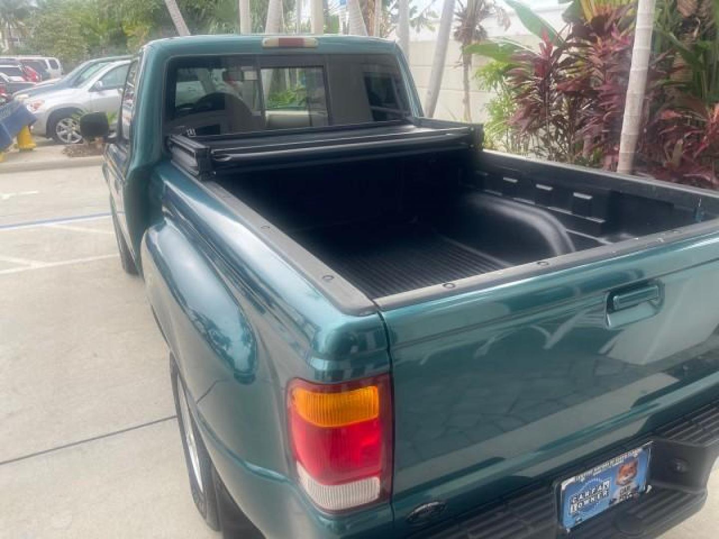 1998 Deep Emerald Green (CC/Met) /Medium Graphite Ford Ranger XL LOW MILES 4 CYL LOW MILES (1FTYR10C0WP) with an 2.5L EFI 4-Cyl Engine engine, Automatic transmission, located at 4701 North Dixie Hwy, Pompano Beach, FL, 33064, (954) 422-2889, 26.240938, -80.123474 - OUR WEBPAGE FLORIDACARS1.COM HAS OVER 100 PHOTOS AND FREE CARFAX LINK 1998 FORD RANGER SPLASH FLARESIDE VIN: 1FTYR10C0WPA84443 1 F T Y R 1 0 C 0 W P A 8 4 4 4 3 PICKUP 2.5L I4 F SOHC 8V GASOLINE 27 MPG REAR WHEEL DRIVE Features ABS Brakes Automatic Transmission Cassette Player Cloth Seats Ice Cold A - Photo#78