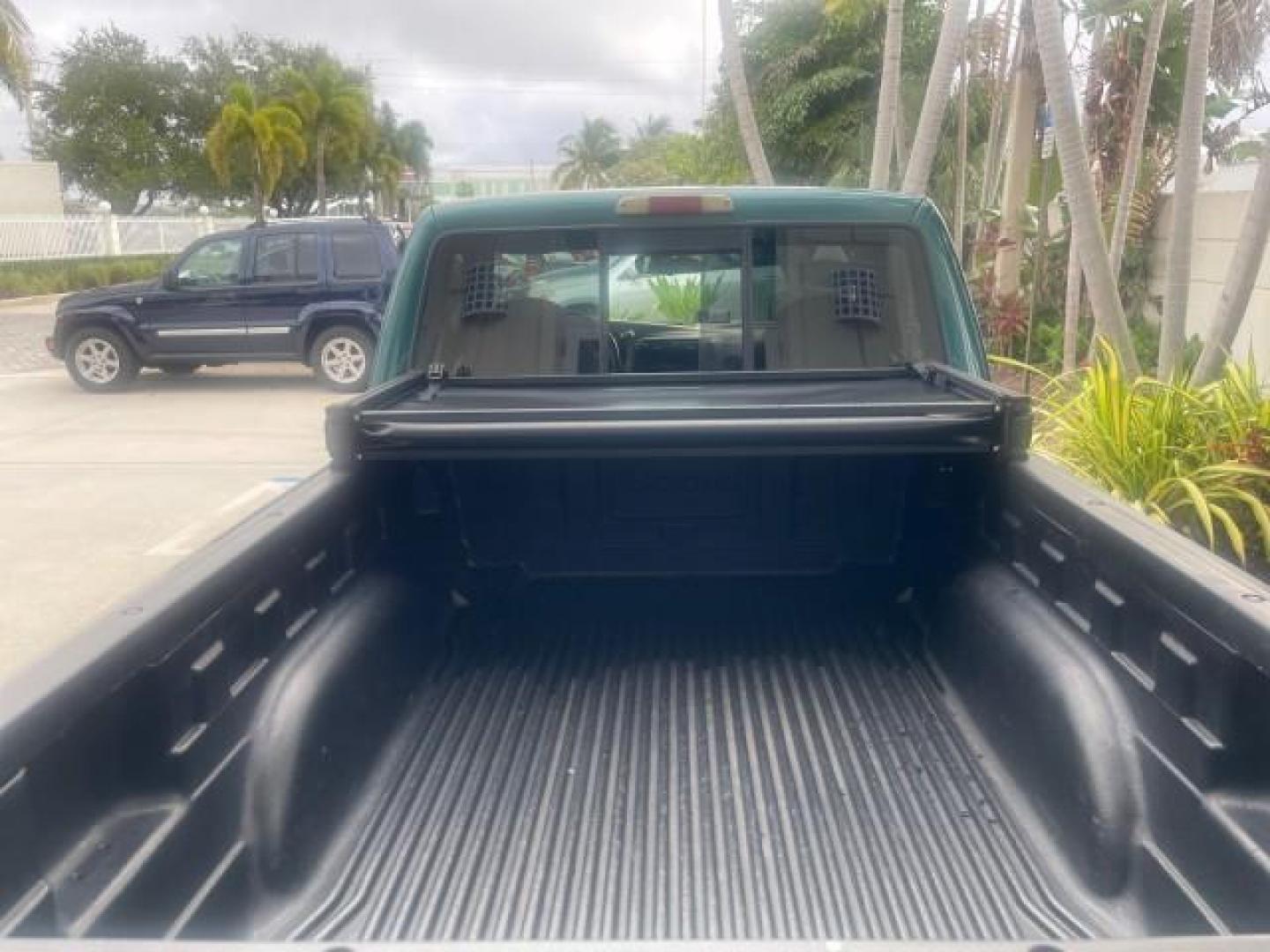 1998 Deep Emerald Green (CC/Met) /Medium Graphite Ford Ranger XL LOW MILES 4 CYL LOW MILES (1FTYR10C0WP) with an 2.5L EFI 4-Cyl Engine engine, Automatic transmission, located at 4701 North Dixie Hwy, Pompano Beach, FL, 33064, (954) 422-2889, 26.240938, -80.123474 - OUR WEBPAGE FLORIDACARS1.COM HAS OVER 100 PHOTOS AND FREE CARFAX LINK 1998 FORD RANGER SPLASH FLARESIDE VIN: 1FTYR10C0WPA84443 1 F T Y R 1 0 C 0 W P A 8 4 4 4 3 PICKUP 2.5L I4 F SOHC 8V GASOLINE 27 MPG REAR WHEEL DRIVE Features ABS Brakes Automatic Transmission Cassette Player Cloth Seats Ice Cold A - Photo#79