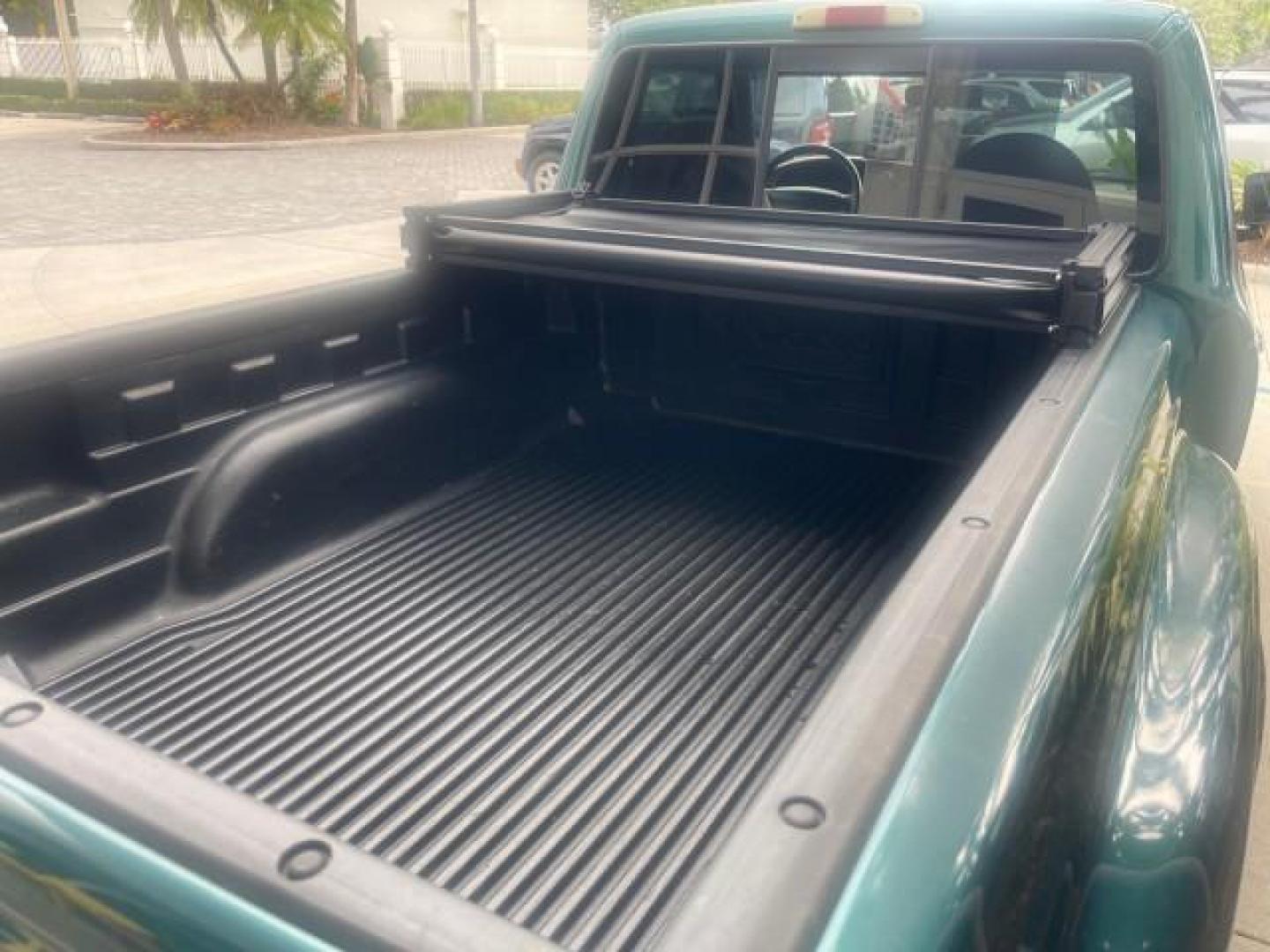 1998 Deep Emerald Green (CC/Met) /Medium Graphite Ford Ranger XL LOW MILES 4 CYL LOW MILES (1FTYR10C0WP) with an 2.5L EFI 4-Cyl Engine engine, Automatic transmission, located at 4701 North Dixie Hwy, Pompano Beach, FL, 33064, (954) 422-2889, 26.240938, -80.123474 - OUR WEBPAGE FLORIDACARS1.COM HAS OVER 100 PHOTOS AND FREE CARFAX LINK 1998 FORD RANGER SPLASH FLARESIDE VIN: 1FTYR10C0WPA84443 1 F T Y R 1 0 C 0 W P A 8 4 4 4 3 PICKUP 2.5L I4 F SOHC 8V GASOLINE 27 MPG REAR WHEEL DRIVE Features ABS Brakes Automatic Transmission Cassette Player Cloth Seats Ice Cold A - Photo#80