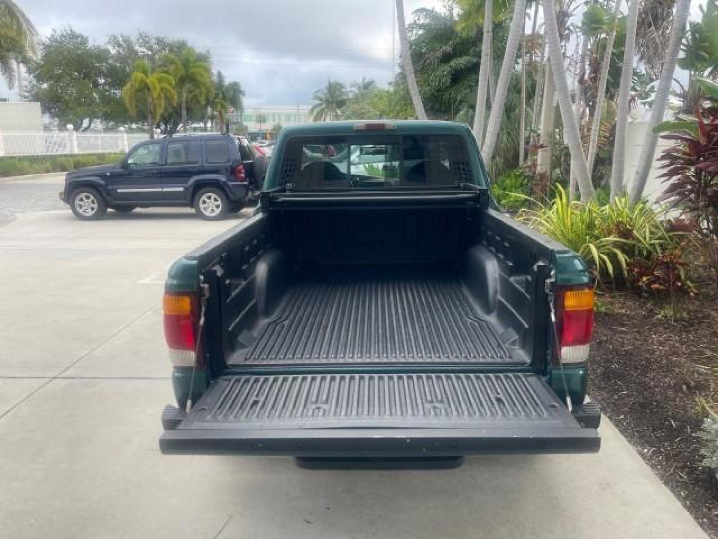 1998 Deep Emerald Green (CC/Met) /Medium Graphite Ford Ranger XL LOW MILES 4 CYL LOW MILES (1FTYR10C0WP) with an 2.5L EFI 4-Cyl Engine engine, Automatic transmission, located at 4701 North Dixie Hwy, Pompano Beach, FL, 33064, (954) 422-2889, 26.240938, -80.123474 - OUR WEBPAGE FLORIDACARS1.COM HAS OVER 100 PHOTOS AND FREE CARFAX LINK 1998 FORD RANGER SPLASH FLARESIDE VIN: 1FTYR10C0WPA84443 1 F T Y R 1 0 C 0 W P A 8 4 4 4 3 PICKUP 2.5L I4 F SOHC 8V GASOLINE 27 MPG REAR WHEEL DRIVE Features ABS Brakes Automatic Transmission Cassette Player Cloth Seats Ice Cold A - Photo#81