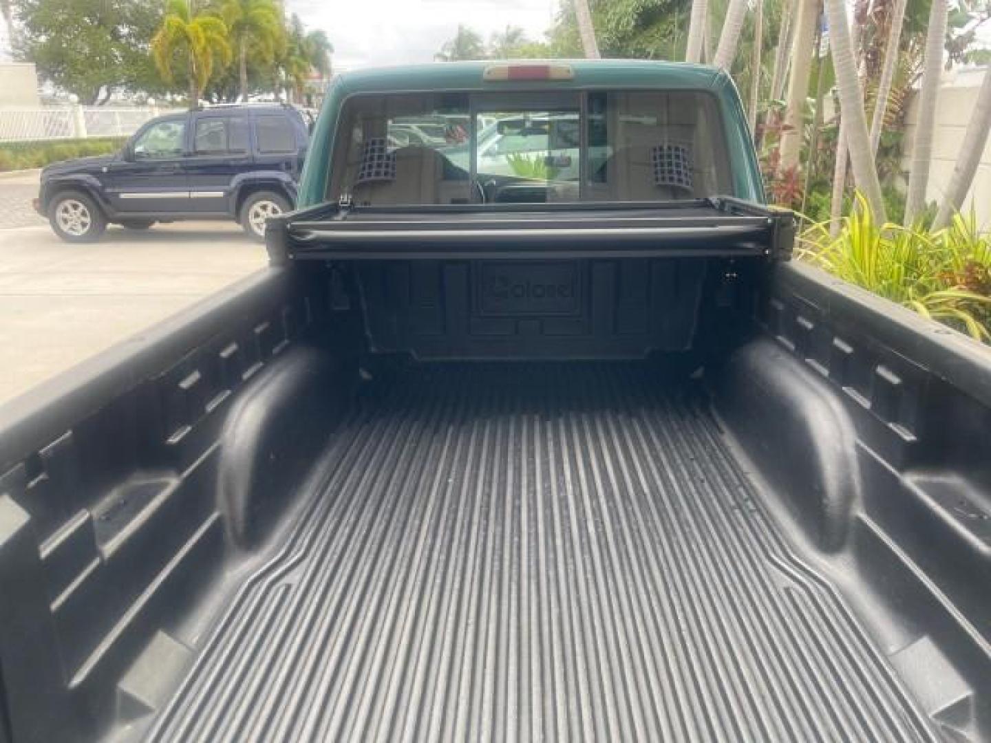1998 Deep Emerald Green (CC/Met) /Medium Graphite Ford Ranger XL LOW MILES 4 CYL LOW MILES (1FTYR10C0WP) with an 2.5L EFI 4-Cyl Engine engine, Automatic transmission, located at 4701 North Dixie Hwy, Pompano Beach, FL, 33064, (954) 422-2889, 26.240938, -80.123474 - OUR WEBPAGE FLORIDACARS1.COM HAS OVER 100 PHOTOS AND FREE CARFAX LINK 1998 FORD RANGER SPLASH FLARESIDE VIN: 1FTYR10C0WPA84443 1 F T Y R 1 0 C 0 W P A 8 4 4 4 3 PICKUP 2.5L I4 F SOHC 8V GASOLINE 27 MPG REAR WHEEL DRIVE Features ABS Brakes Automatic Transmission Cassette Player Cloth Seats Ice Cold A - Photo#83
