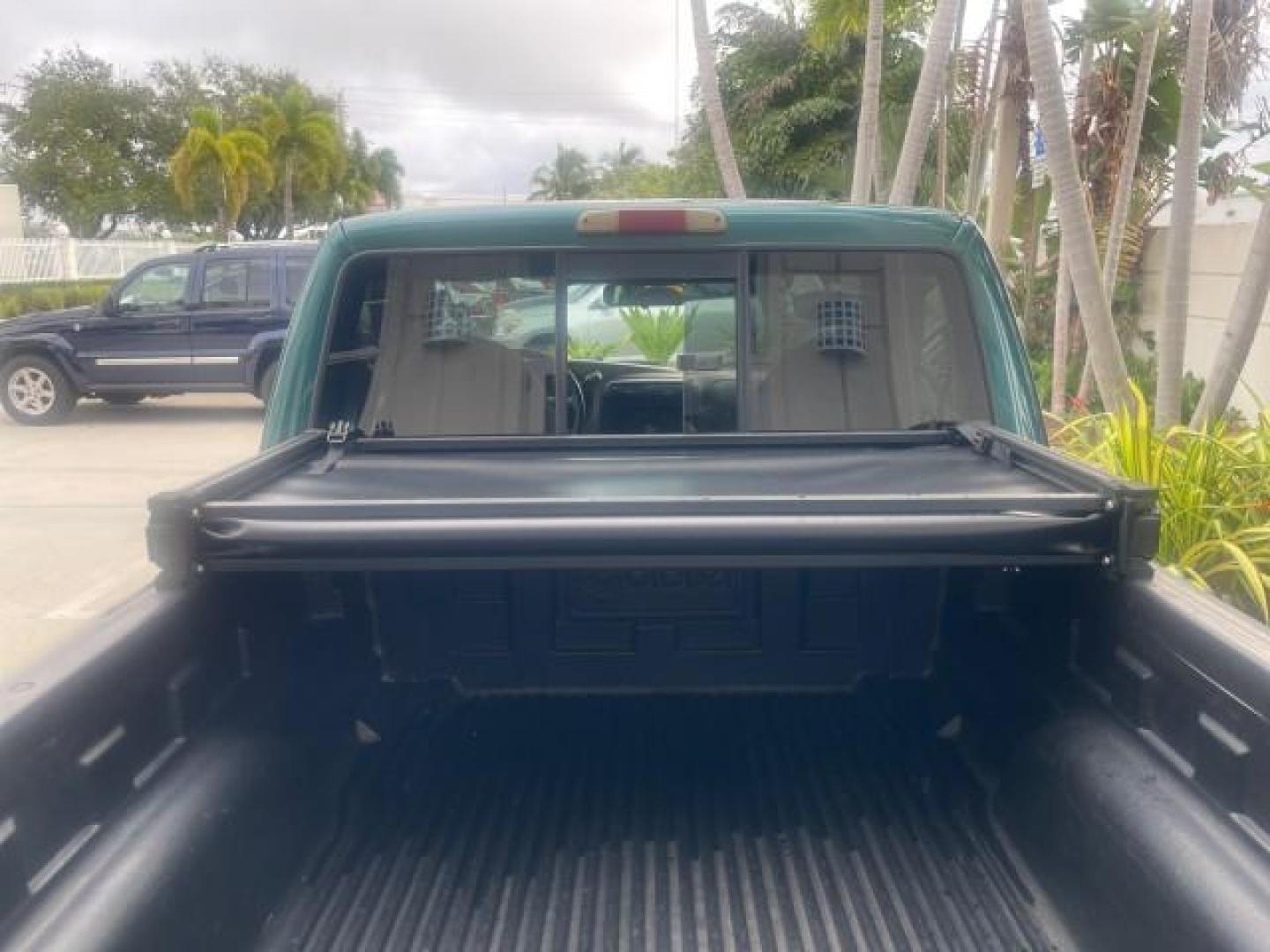 1998 Deep Emerald Green (CC/Met) /Medium Graphite Ford Ranger XL LOW MILES 4 CYL LOW MILES (1FTYR10C0WP) with an 2.5L EFI 4-Cyl Engine engine, Automatic transmission, located at 4701 North Dixie Hwy, Pompano Beach, FL, 33064, (954) 422-2889, 26.240938, -80.123474 - OUR WEBPAGE FLORIDACARS1.COM HAS OVER 100 PHOTOS AND FREE CARFAX LINK 1998 FORD RANGER SPLASH FLARESIDE VIN: 1FTYR10C0WPA84443 1 F T Y R 1 0 C 0 W P A 8 4 4 4 3 PICKUP 2.5L I4 F SOHC 8V GASOLINE 27 MPG REAR WHEEL DRIVE Features ABS Brakes Automatic Transmission Cassette Player Cloth Seats Ice Cold A - Photo#84