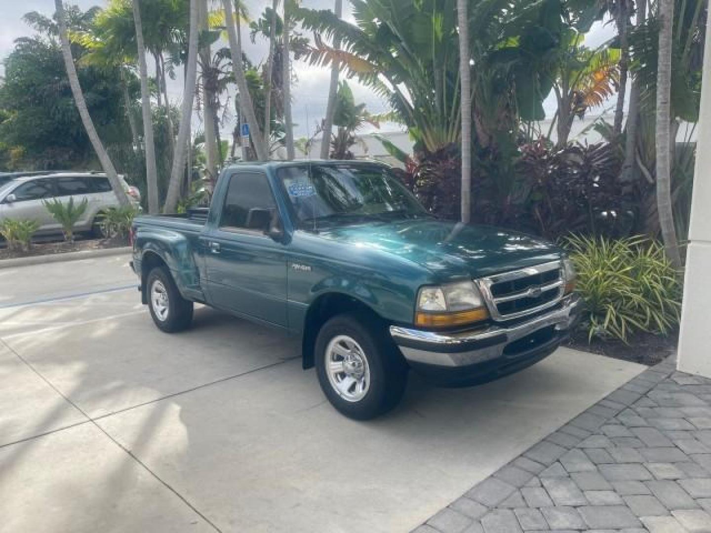 1998 Deep Emerald Green (CC/Met) /Medium Graphite Ford Ranger XL LOW MILES 4 CYL LOW MILES (1FTYR10C0WP) with an 2.5L EFI 4-Cyl Engine engine, Automatic transmission, located at 4701 North Dixie Hwy, Pompano Beach, FL, 33064, (954) 422-2889, 26.240938, -80.123474 - OUR WEBPAGE FLORIDACARS1.COM HAS OVER 100 PHOTOS AND FREE CARFAX LINK 1998 FORD RANGER SPLASH FLARESIDE VIN: 1FTYR10C0WPA84443 1 F T Y R 1 0 C 0 W P A 8 4 4 4 3 PICKUP 2.5L I4 F SOHC 8V GASOLINE 27 MPG REAR WHEEL DRIVE Features ABS Brakes Automatic Transmission Cassette Player Cloth Seats Ice Cold A - Photo#93