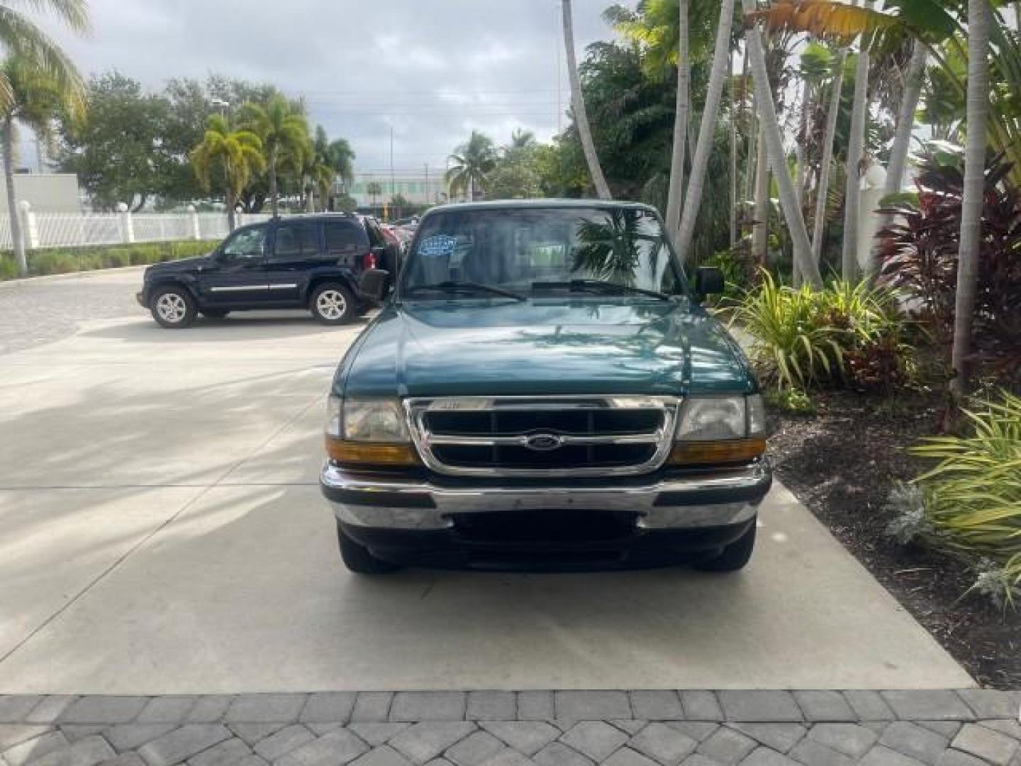 1998 Deep Emerald Green (CC/Met) /Medium Graphite Ford Ranger XL LOW MILES 4 CYL LOW MILES (1FTYR10C0WP) with an 2.5L EFI 4-Cyl Engine engine, Automatic transmission, located at 4701 North Dixie Hwy, Pompano Beach, FL, 33064, (954) 422-2889, 26.240938, -80.123474 - OUR WEBPAGE FLORIDACARS1.COM HAS OVER 100 PHOTOS AND FREE CARFAX LINK 1998 FORD RANGER SPLASH FLARESIDE VIN: 1FTYR10C0WPA84443 1 F T Y R 1 0 C 0 W P A 8 4 4 4 3 PICKUP 2.5L I4 F SOHC 8V GASOLINE 27 MPG REAR WHEEL DRIVE Features ABS Brakes Automatic Transmission Cassette Player Cloth Seats Ice Cold A - Photo#94