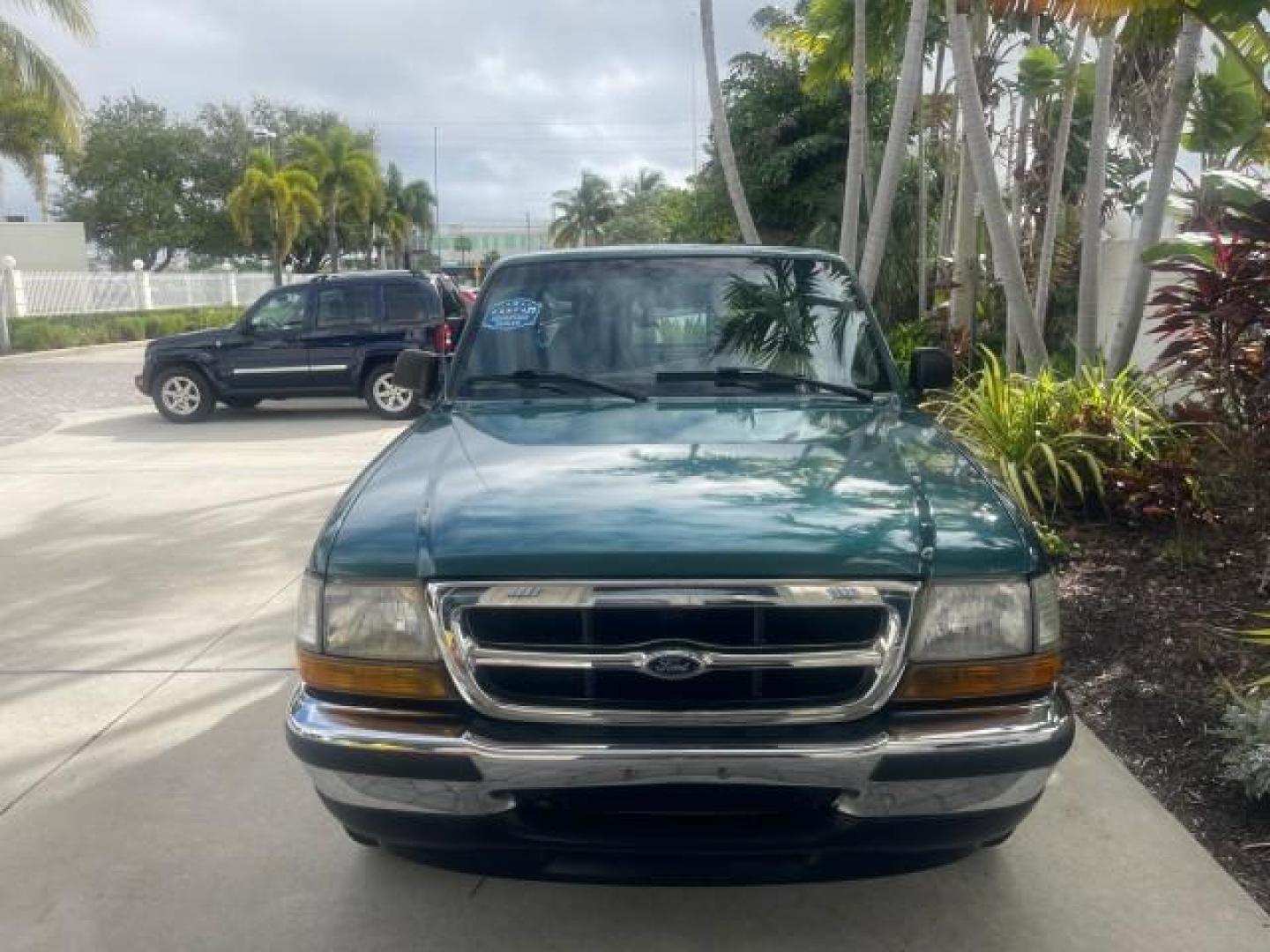1998 Deep Emerald Green (CC/Met) /Medium Graphite Ford Ranger XL LOW MILES 4 CYL LOW MILES (1FTYR10C0WP) with an 2.5L EFI 4-Cyl Engine engine, Automatic transmission, located at 4701 North Dixie Hwy, Pompano Beach, FL, 33064, (954) 422-2889, 26.240938, -80.123474 - OUR WEBPAGE FLORIDACARS1.COM HAS OVER 100 PHOTOS AND FREE CARFAX LINK 1998 FORD RANGER SPLASH FLARESIDE VIN: 1FTYR10C0WPA84443 1 F T Y R 1 0 C 0 W P A 8 4 4 4 3 PICKUP 2.5L I4 F SOHC 8V GASOLINE 27 MPG REAR WHEEL DRIVE Features ABS Brakes Automatic Transmission Cassette Player Cloth Seats Ice Cold A - Photo#95