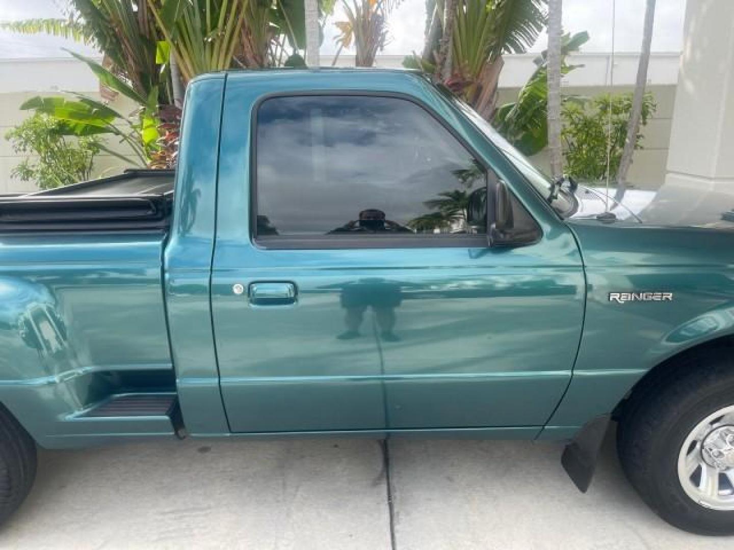 1998 Deep Emerald Green (CC/Met) /Medium Graphite Ford Ranger XL LOW MILES 4 CYL LOW MILES (1FTYR10C0WP) with an 2.5L EFI 4-Cyl Engine engine, Automatic transmission, located at 4701 North Dixie Hwy, Pompano Beach, FL, 33064, (954) 422-2889, 26.240938, -80.123474 - OUR WEBPAGE FLORIDACARS1.COM HAS OVER 100 PHOTOS AND FREE CARFAX LINK 1998 FORD RANGER SPLASH FLARESIDE VIN: 1FTYR10C0WPA84443 1 F T Y R 1 0 C 0 W P A 8 4 4 4 3 PICKUP 2.5L I4 F SOHC 8V GASOLINE 27 MPG REAR WHEEL DRIVE Features ABS Brakes Automatic Transmission Cassette Player Cloth Seats Ice Cold A - Photo#96