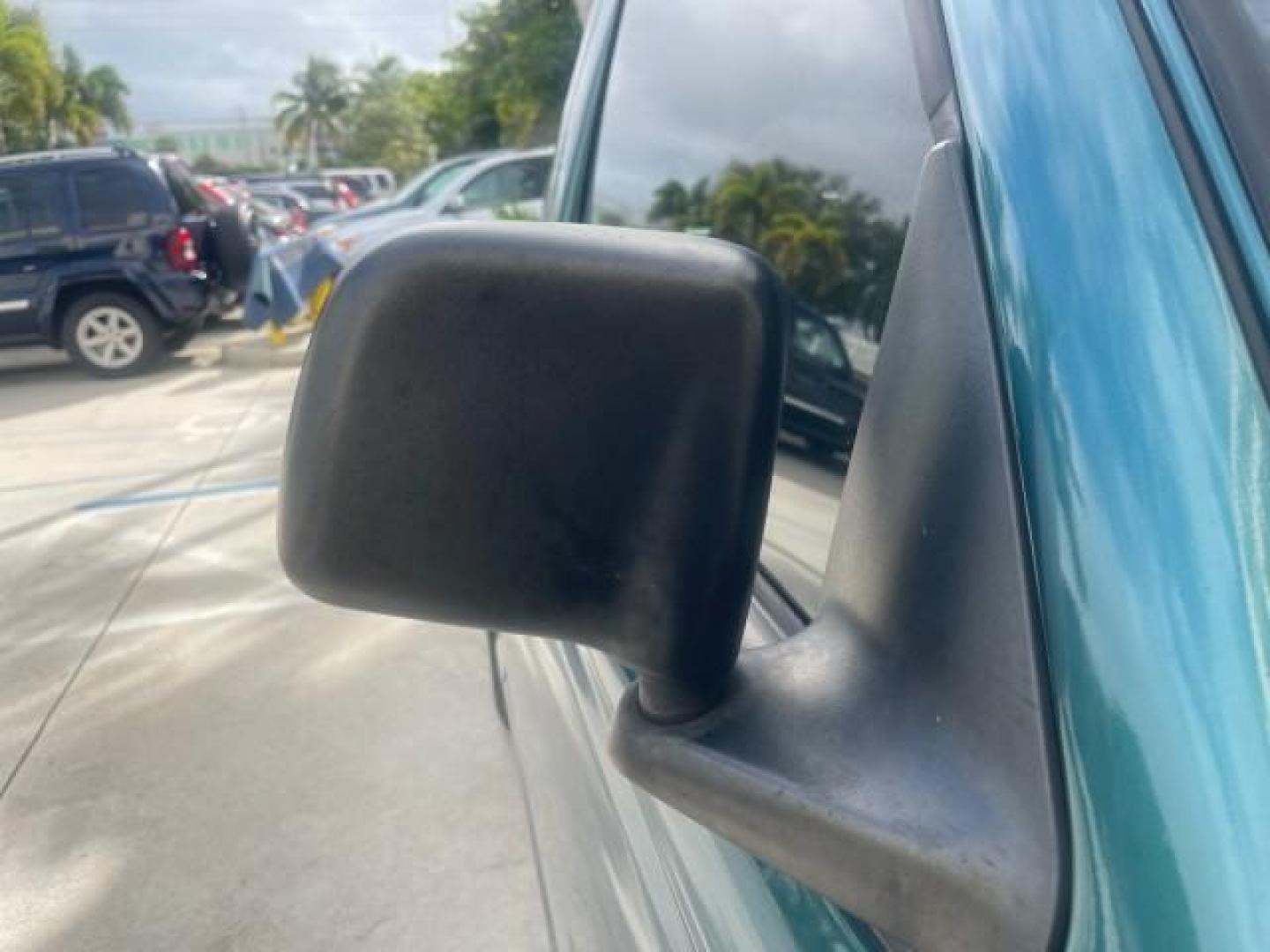 1998 Deep Emerald Green (CC/Met) /Medium Graphite Ford Ranger XL LOW MILES 4 CYL LOW MILES (1FTYR10C0WP) with an 2.5L EFI 4-Cyl Engine engine, Automatic transmission, located at 4701 North Dixie Hwy, Pompano Beach, FL, 33064, (954) 422-2889, 26.240938, -80.123474 - OUR WEBPAGE FLORIDACARS1.COM HAS OVER 100 PHOTOS AND FREE CARFAX LINK 1998 FORD RANGER SPLASH FLARESIDE VIN: 1FTYR10C0WPA84443 1 F T Y R 1 0 C 0 W P A 8 4 4 4 3 PICKUP 2.5L I4 F SOHC 8V GASOLINE 27 MPG REAR WHEEL DRIVE Features ABS Brakes Automatic Transmission Cassette Player Cloth Seats Ice Cold A - Photo#99