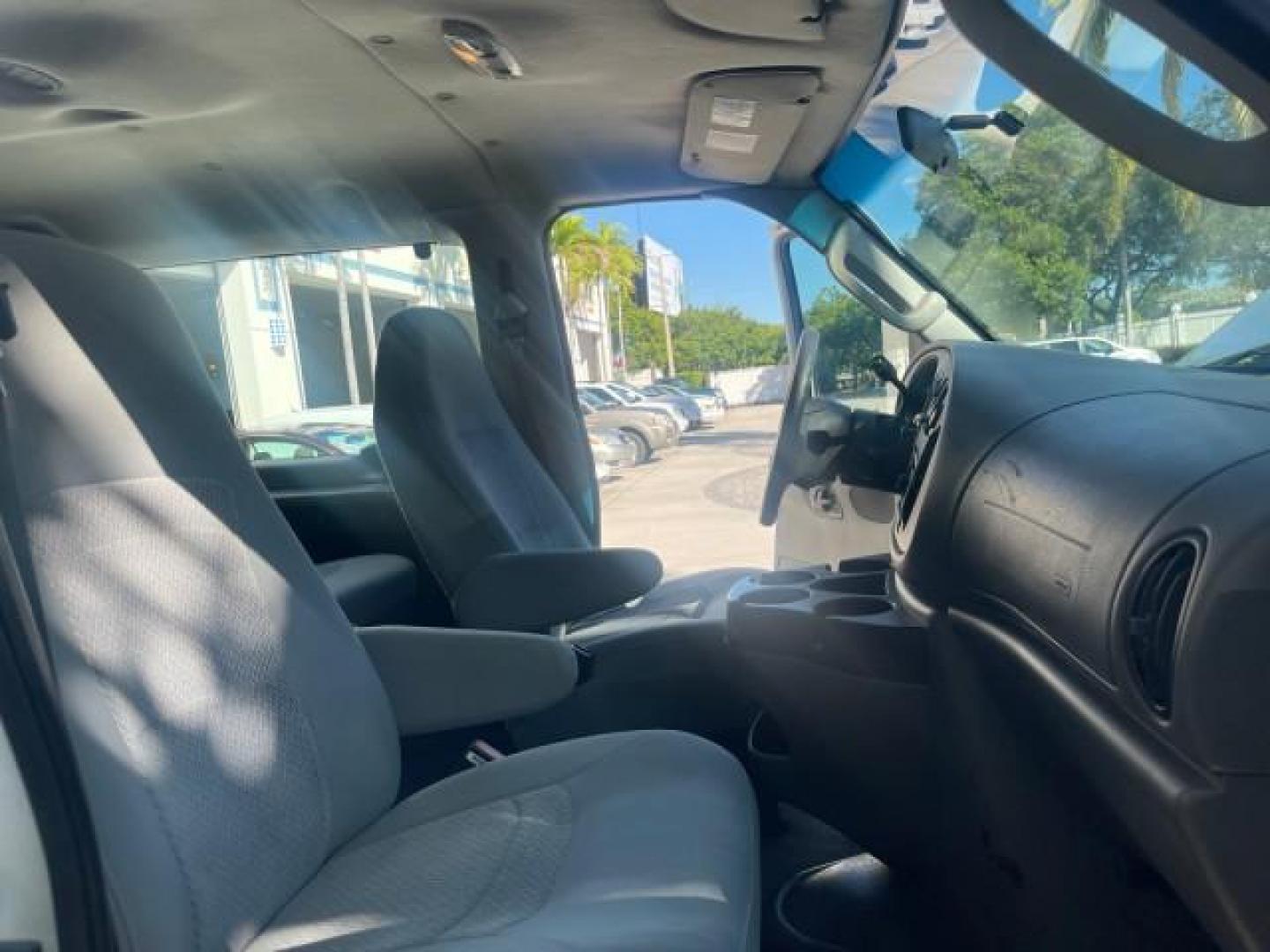 2006 Oxford White /Medium Flint Ford Econoline Wagon XLT LOW MILES 76,474 E350 15 PASS (1FBSS31L36H) with an 5.4L EFI V8 Engine engine, Automatic transmission, located at 4701 North Dixie Hwy, Pompano Beach, FL, 33064, (954) 422-2889, 26.240938, -80.123474 - OUR WEBPAGE FLORIDACARS1.COM HAS OVER 100 PHOTOS AND FREE CARFAX LINK 2006 FORD E-SERIES E-350 SD XLT 15 PASSENGER VAN NEW $29,805 VIN: 1FBSS31L36HA01462 1 F B S S 3 1 L 3 6 H A 0 1 4 6 2 VAN 5.4L V8 F GASOLINE REAR WHEEL DRIVE Features ABS Brakes Air Conditioning AM/FM Stereo Automatic Transmission - Photo#12