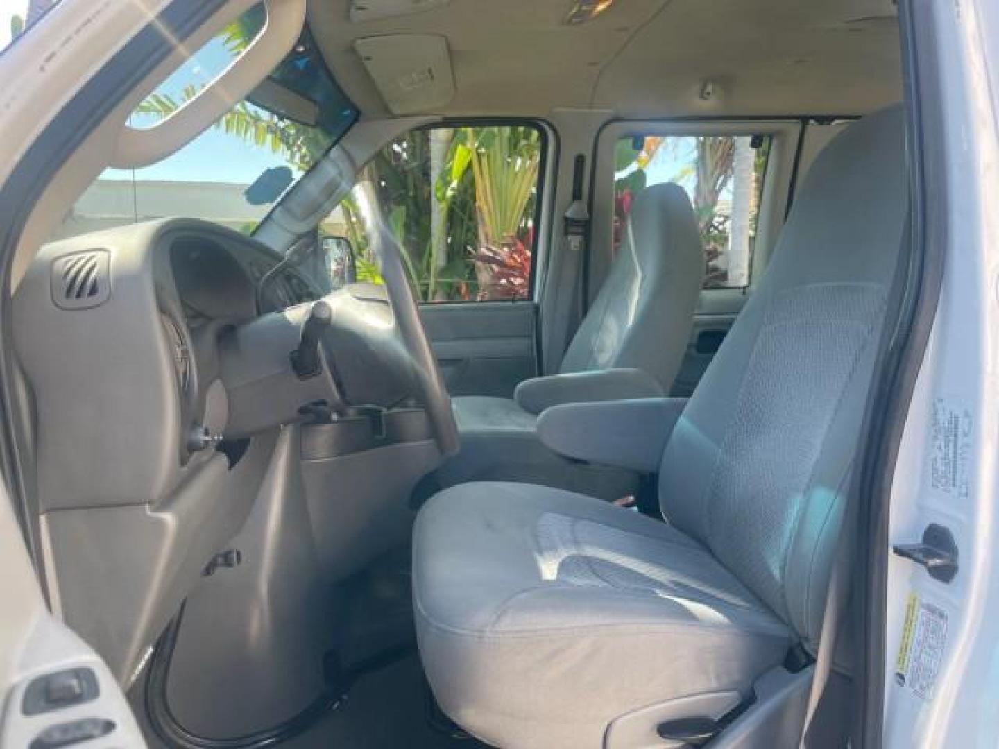 2006 Oxford White /Medium Flint Ford Econoline Wagon XLT LOW MILES 76,474 E350 15 PASS (1FBSS31L36H) with an 5.4L EFI V8 Engine engine, Automatic transmission, located at 4701 North Dixie Hwy, Pompano Beach, FL, 33064, (954) 422-2889, 26.240938, -80.123474 - OUR WEBPAGE FLORIDACARS1.COM HAS OVER 100 PHOTOS AND FREE CARFAX LINK 2006 FORD E-SERIES E-350 SD XLT 15 PASSENGER VAN NEW $29,805 VIN: 1FBSS31L36HA01462 1 F B S S 3 1 L 3 6 H A 0 1 4 6 2 VAN 5.4L V8 F GASOLINE REAR WHEEL DRIVE Features ABS Brakes Air Conditioning AM/FM Stereo Automatic Transmission - Photo#43