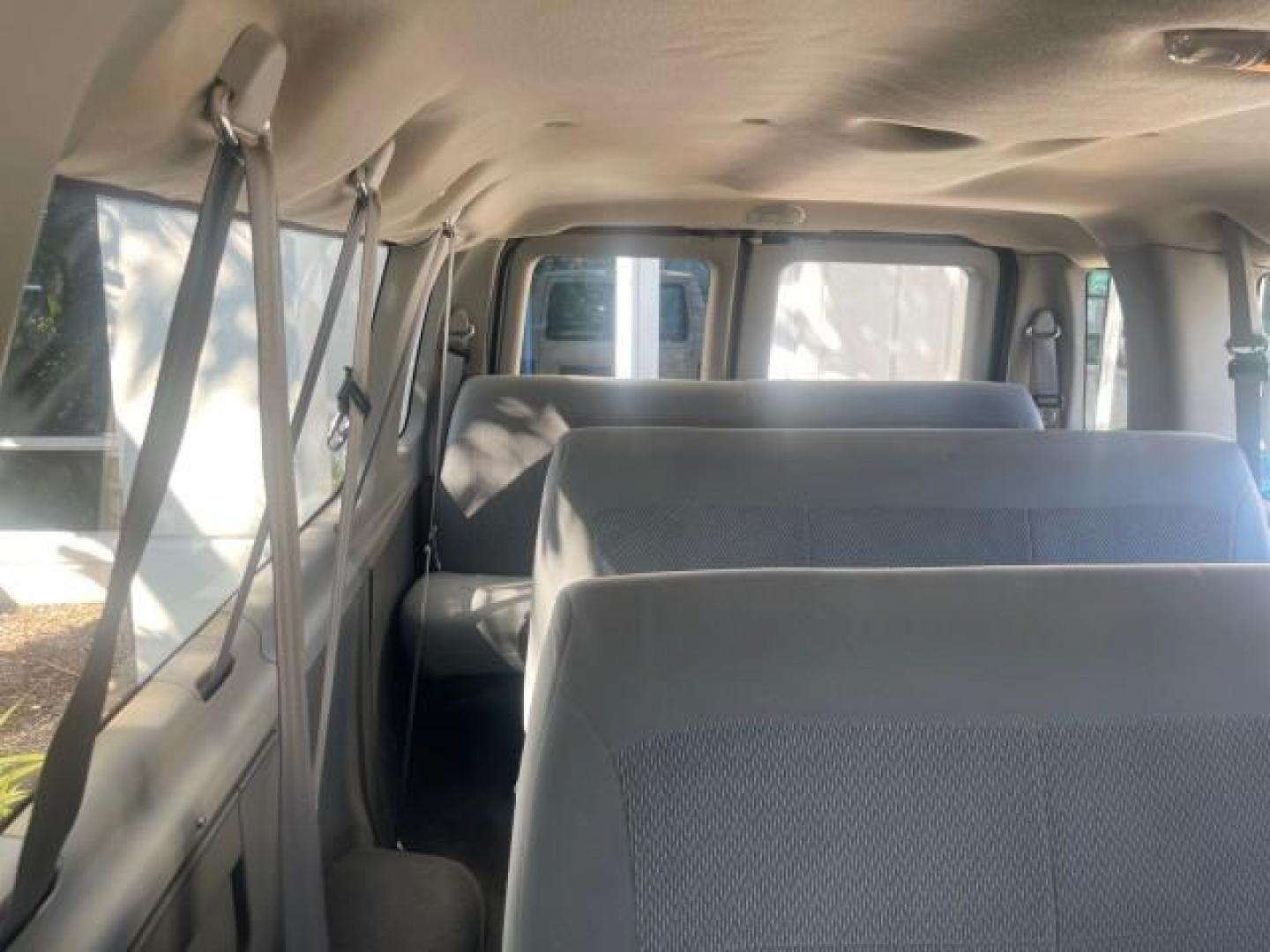 2006 Oxford White /Medium Flint Ford Econoline Wagon XLT LOW MILES 76,474 E350 15 PASS (1FBSS31L36H) with an 5.4L EFI V8 Engine engine, Automatic transmission, located at 4701 North Dixie Hwy, Pompano Beach, FL, 33064, (954) 422-2889, 26.240938, -80.123474 - OUR WEBPAGE FLORIDACARS1.COM HAS OVER 100 PHOTOS AND FREE CARFAX LINK 2006 FORD E-SERIES E-350 SD XLT 15 PASSENGER VAN NEW $29,805 VIN: 1FBSS31L36HA01462 1 F B S S 3 1 L 3 6 H A 0 1 4 6 2 VAN 5.4L V8 F GASOLINE REAR WHEEL DRIVE Features ABS Brakes Air Conditioning AM/FM Stereo Automatic Transmission - Photo#70