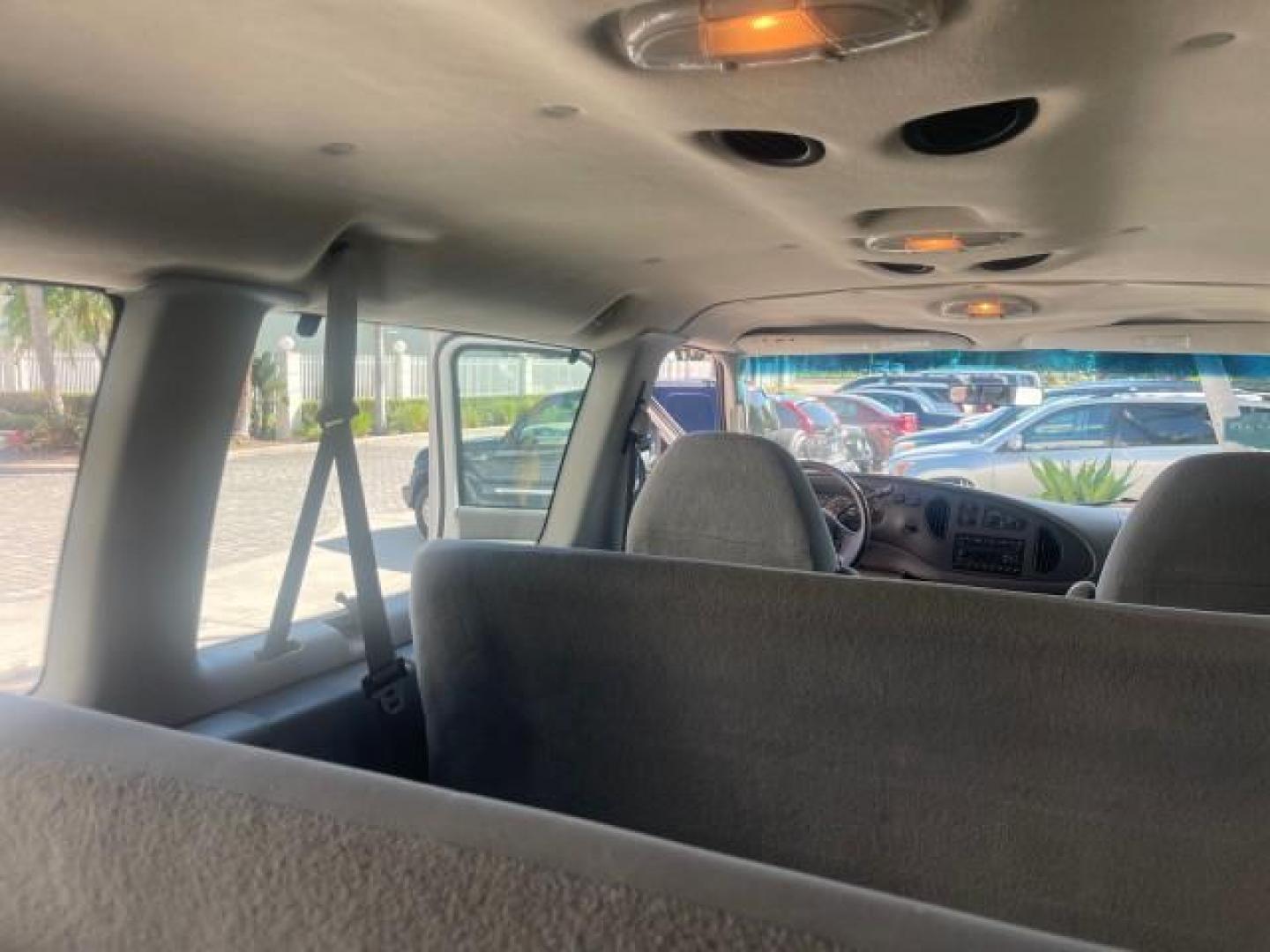 2006 Oxford White /Medium Flint Ford Econoline Wagon XLT LOW MILES 76,474 E350 15 PASS (1FBSS31L36H) with an 5.4L EFI V8 Engine engine, Automatic transmission, located at 4701 North Dixie Hwy, Pompano Beach, FL, 33064, (954) 422-2889, 26.240938, -80.123474 - OUR WEBPAGE FLORIDACARS1.COM HAS OVER 100 PHOTOS AND FREE CARFAX LINK 2006 FORD E-SERIES E-350 SD XLT 15 PASSENGER VAN NEW $29,805 VIN: 1FBSS31L36HA01462 1 F B S S 3 1 L 3 6 H A 0 1 4 6 2 VAN 5.4L V8 F GASOLINE REAR WHEEL DRIVE Features ABS Brakes Air Conditioning AM/FM Stereo Automatic Transmission - Photo#81