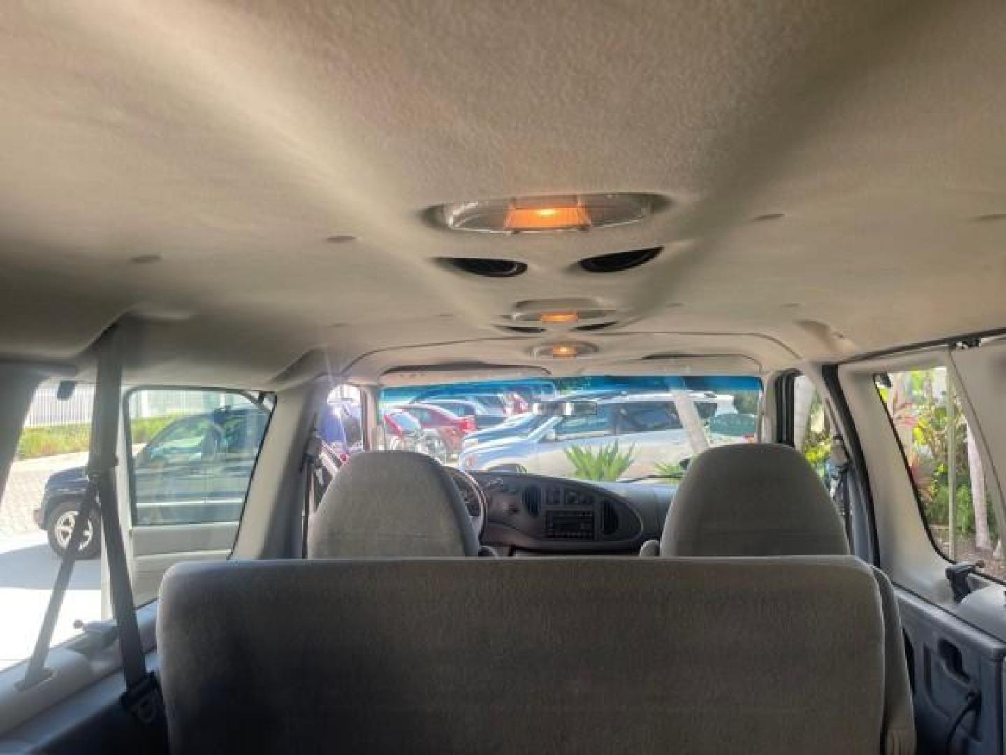2006 Oxford White /Medium Flint Ford Econoline Wagon XLT LOW MILES 76,474 E350 15 PASS (1FBSS31L36H) with an 5.4L EFI V8 Engine engine, Automatic transmission, located at 4701 North Dixie Hwy, Pompano Beach, FL, 33064, (954) 422-2889, 26.240938, -80.123474 - OUR WEBPAGE FLORIDACARS1.COM HAS OVER 100 PHOTOS AND FREE CARFAX LINK 2006 FORD E-SERIES E-350 SD XLT 15 PASSENGER VAN NEW $29,805 VIN: 1FBSS31L36HA01462 1 F B S S 3 1 L 3 6 H A 0 1 4 6 2 VAN 5.4L V8 F GASOLINE REAR WHEEL DRIVE Features ABS Brakes Air Conditioning AM/FM Stereo Automatic Transmission - Photo#82